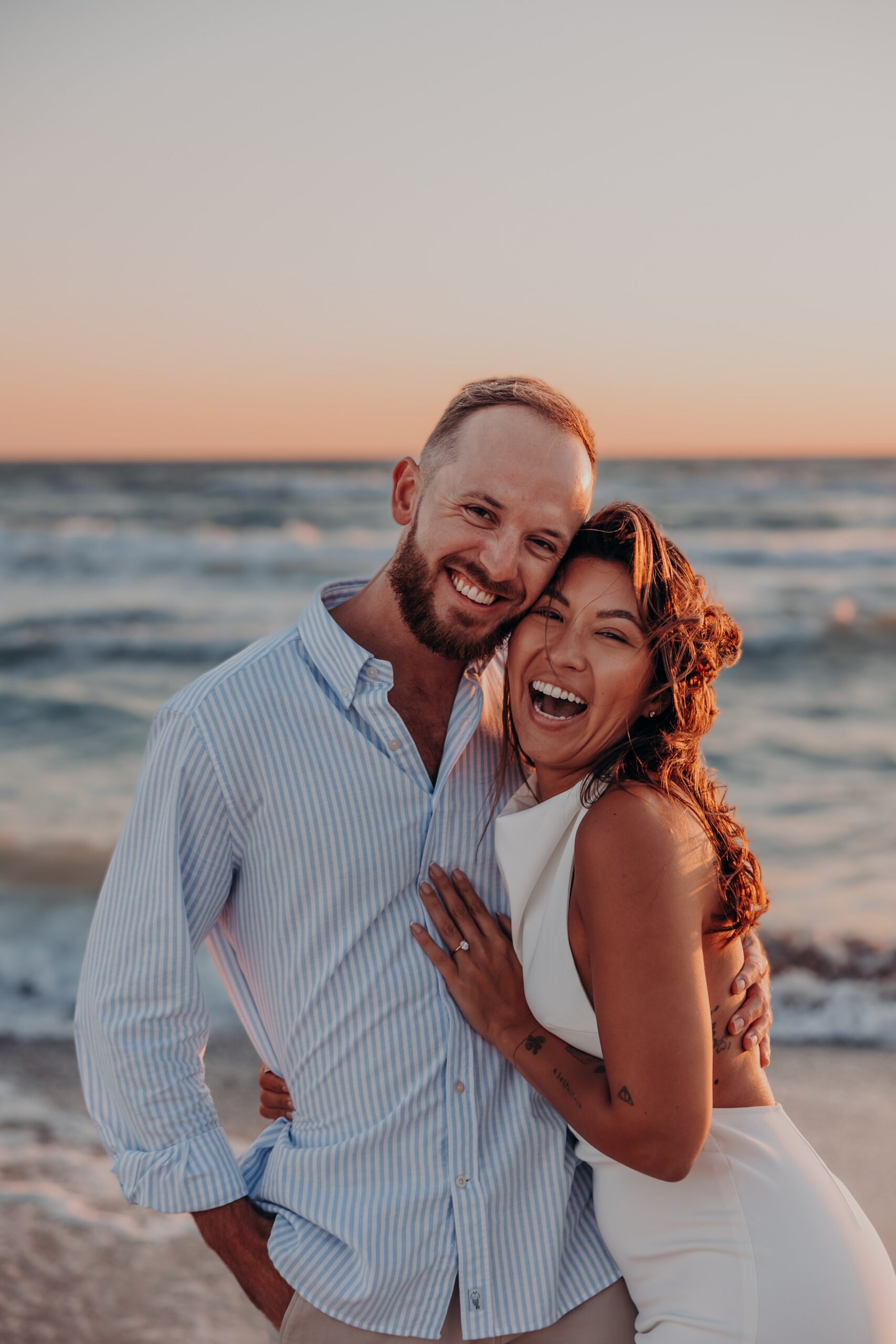 Bianca and Patrick intimate golden hour portrait on Longboat Key beach at sunset after their engagement, photographed by Angela Moon Photography Sarasota FL