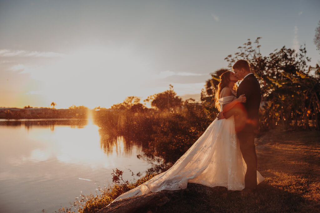 wedding couples portrait with sunset views over the lake at worthington for events 