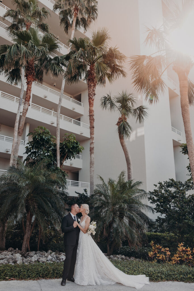 Bride and groom portraits with tropical trees at Longboat Key Club wedding