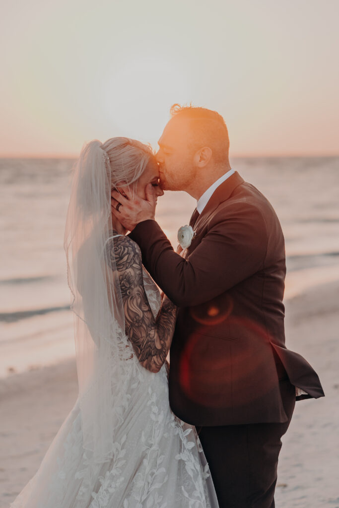 Bride and groom portraits with sunset ocean views at Longboat Key Club wedding