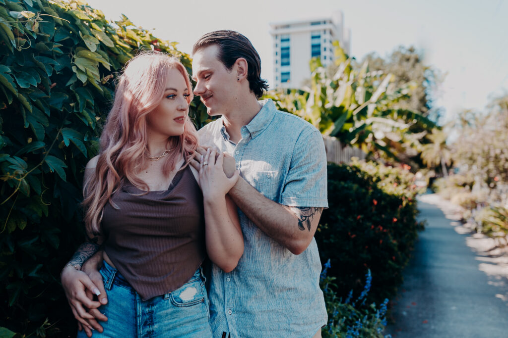 Couple embracing in tropical garden at Selby Botanical Gardens Sarasota Florida