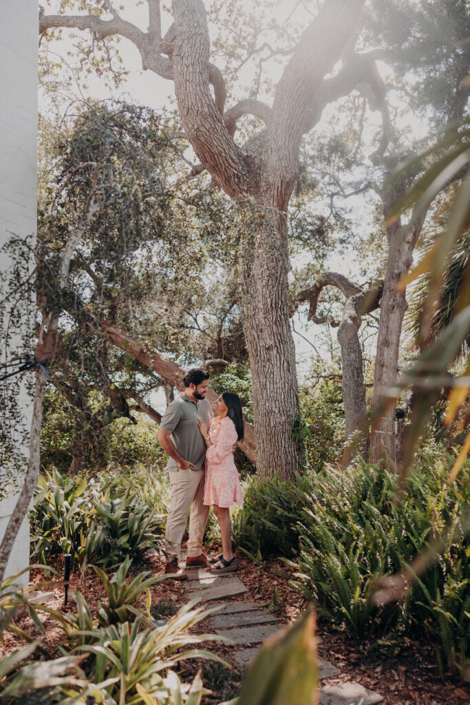 Couple walking together through garden pathways at Selby Botanical Gardens proposal