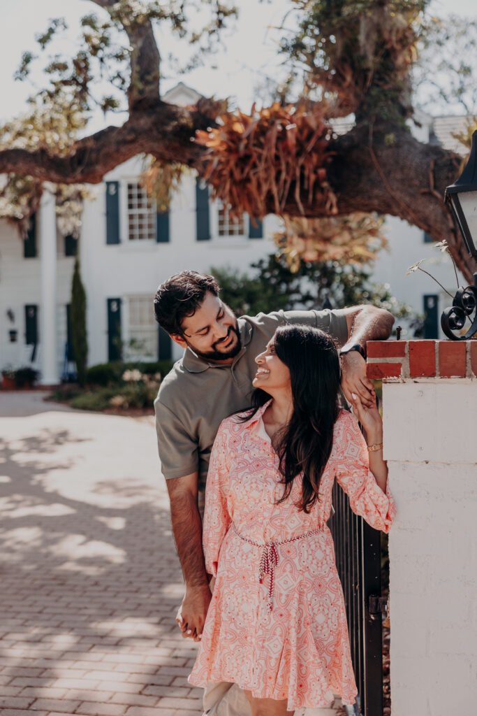 Couple walking together near historic building at Selby Botanical Gardens Sarasota