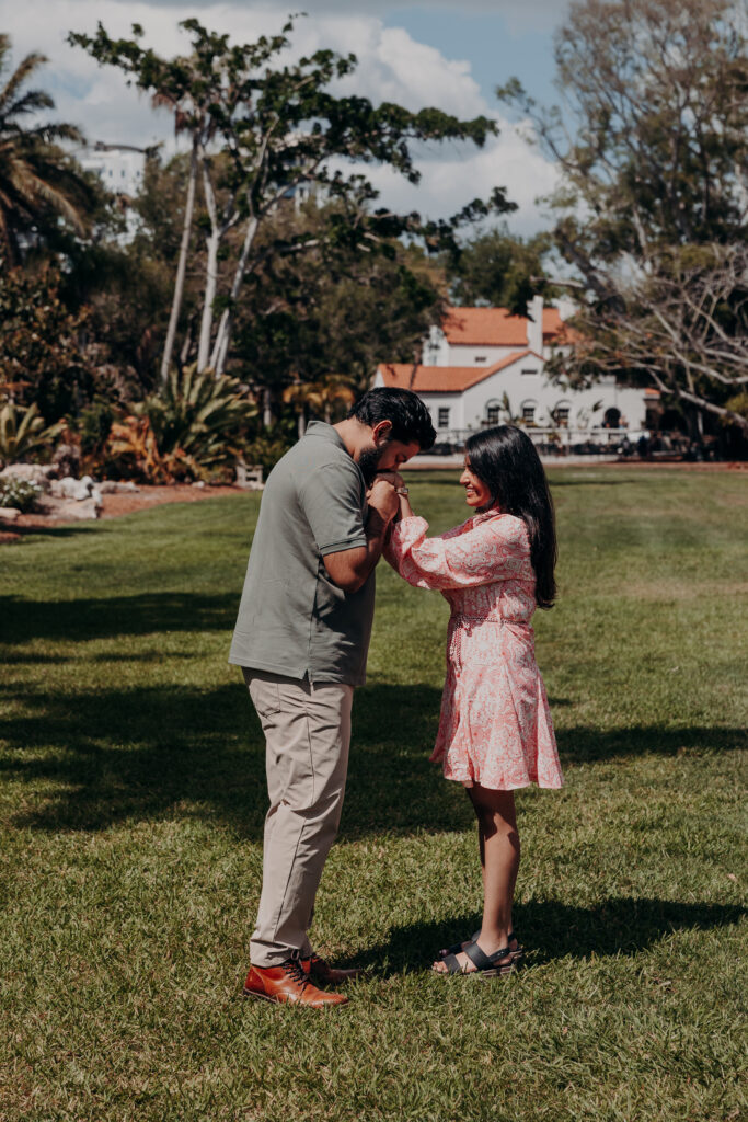 Couple laughing together in garden setting at Selby Botanical Gardens