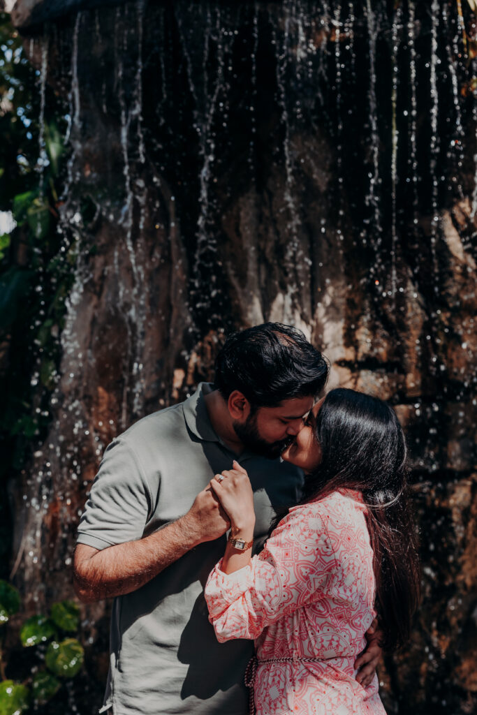 Couple kissing under banyan tree after proposal at Selby Botanical Gardens