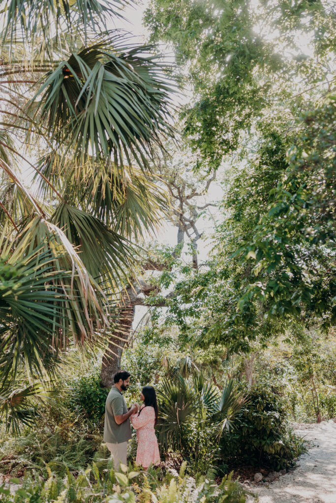 Couple standing on tropical garden pathway at Selby Botanical Gardens Sarasota