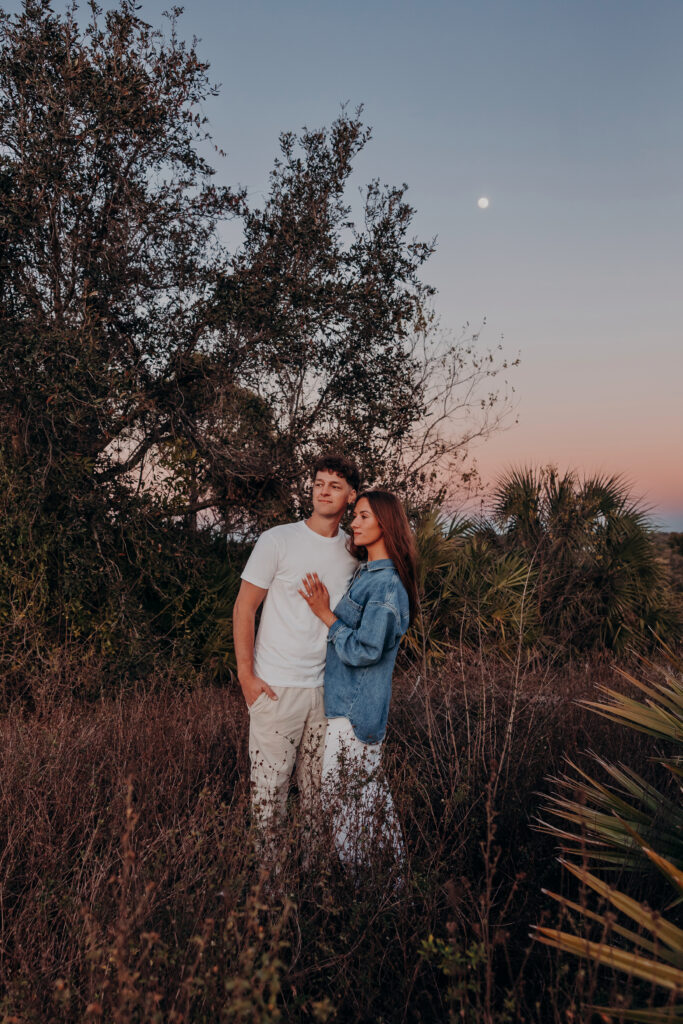 Couple standing together at Celery Fields Sarasota after sunset proposal