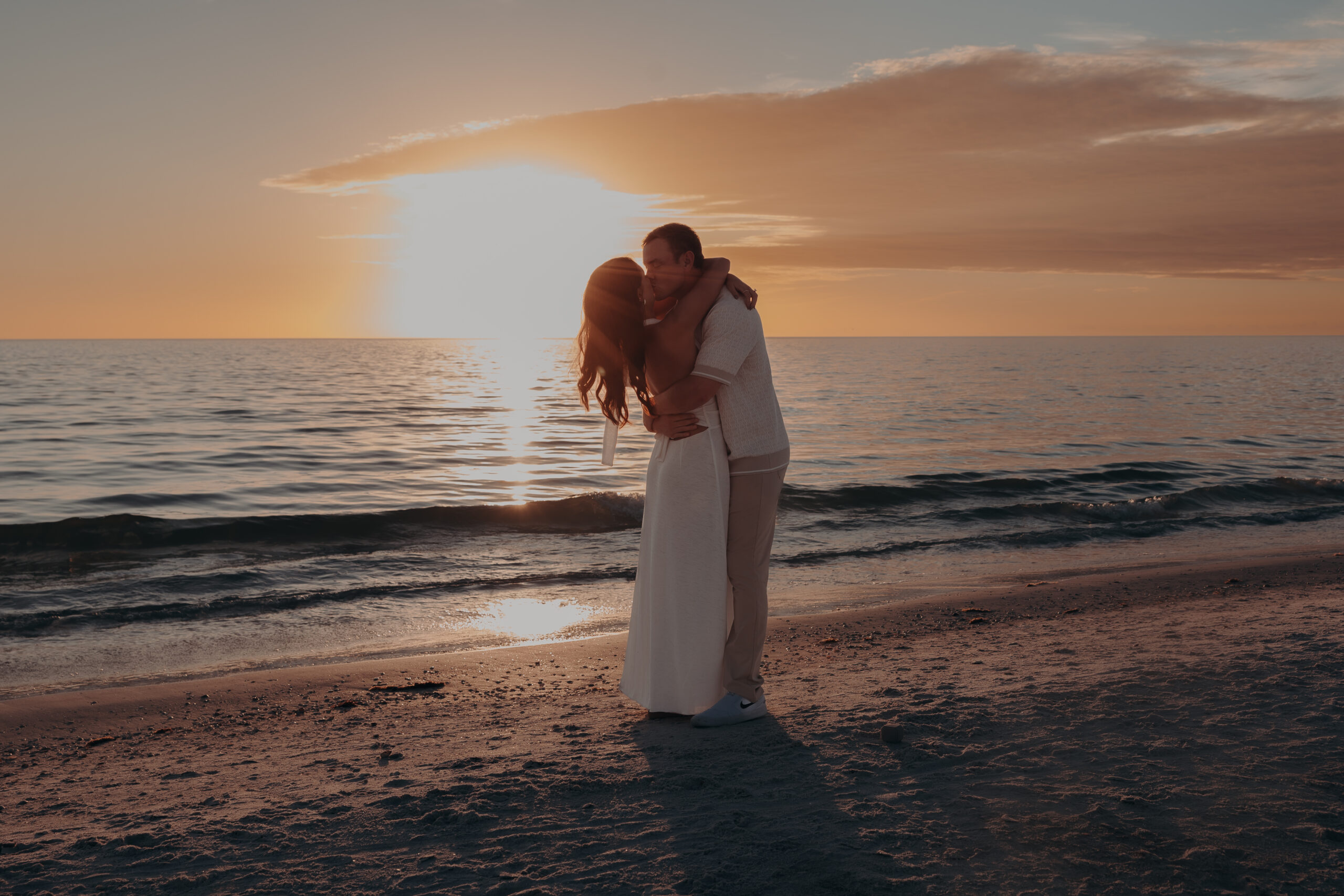 Newly Engaged couple celebrate at sunset after their Siesta Key Beach Proposal