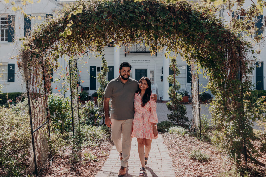 Couple walking under garden archway at Selby Botanical Gardens Sarasota