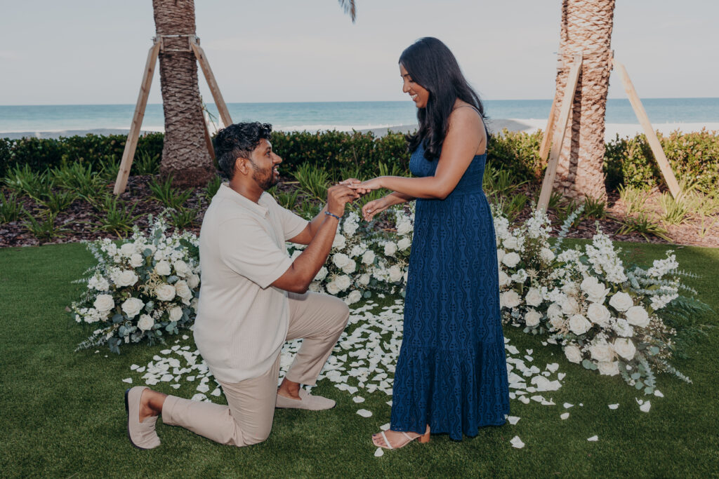 Romantic proposal with floral setup by Certified Cupid at St. Regis Longboat Key