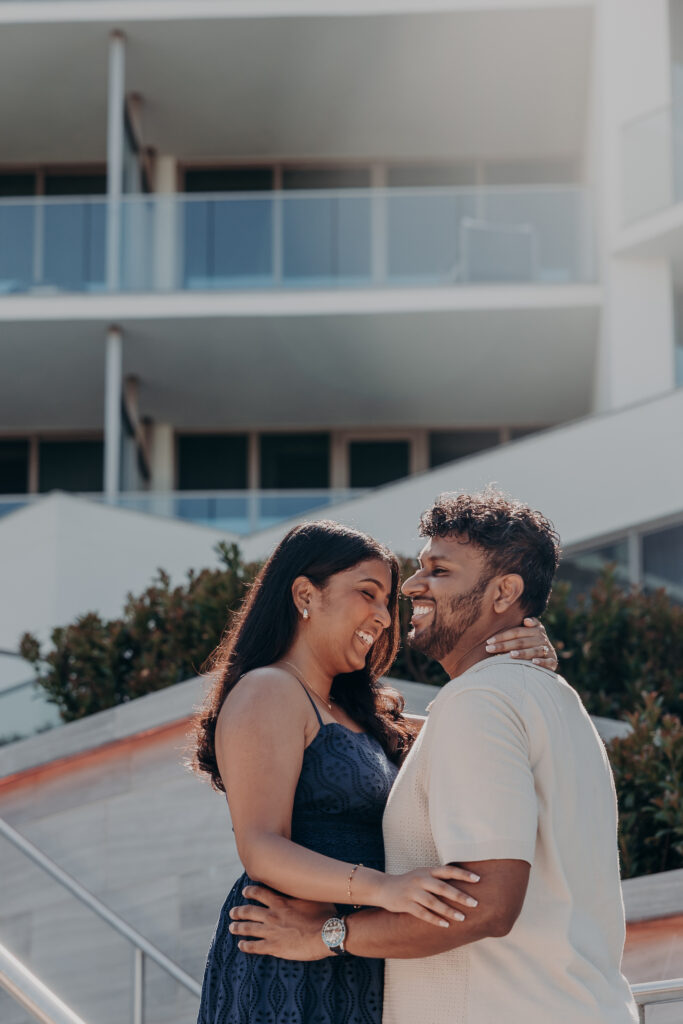 Couple embracing at St. Regis Longboat Key Sarasota during proposal session