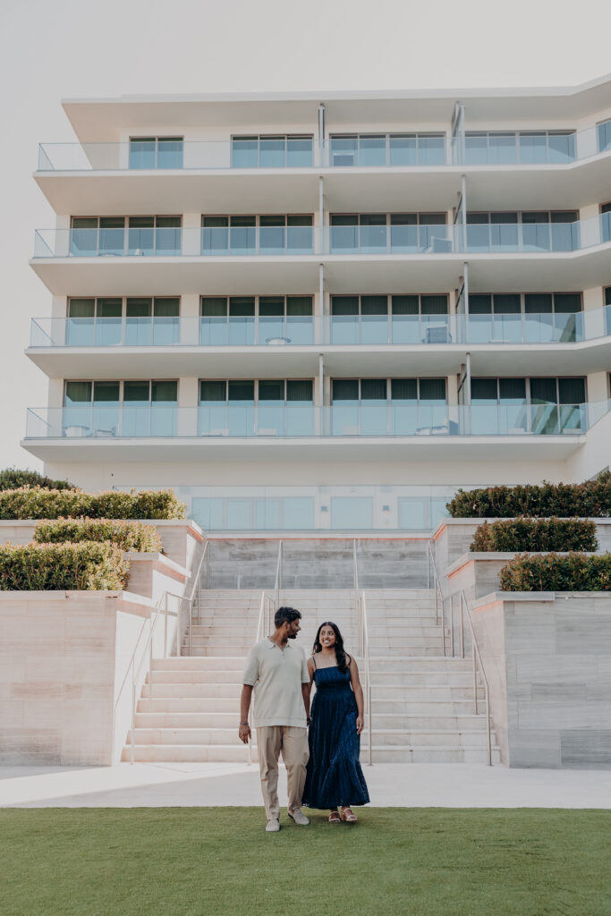 Couple walking at St. Regis Longboat Key Sarasota after beach proposal