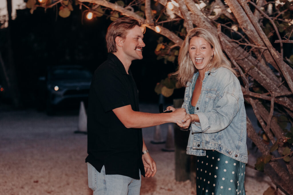 Just engaged couple at Mar Vista Longboat Key celebrating proposal at night