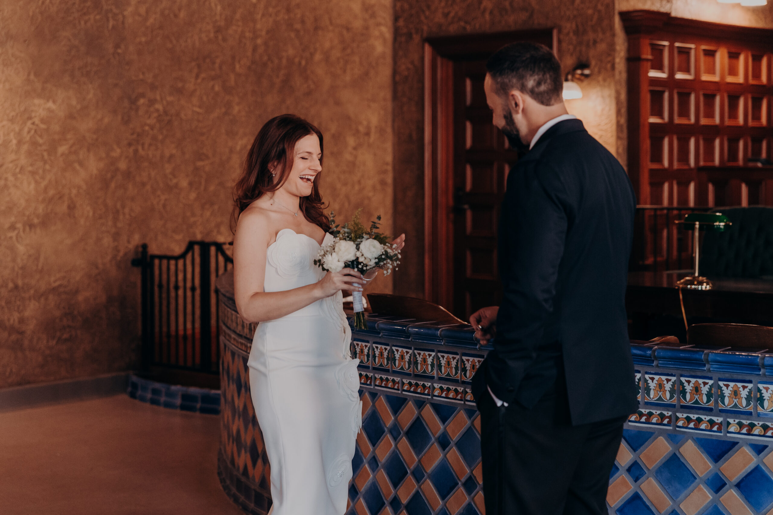 Bride laughing at the altar during indoor ceremony at the Historic Sarasota County Courthouse in Sarasota FL