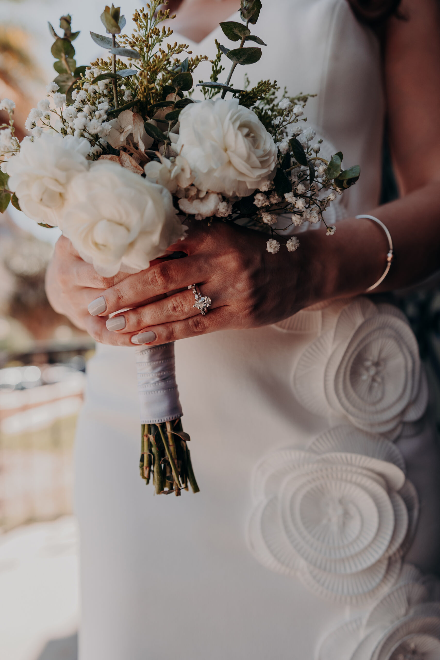 Close-up of the bridal bouquet and wedding ring detail at Diana and Roberts Sarasota courthouse wedding