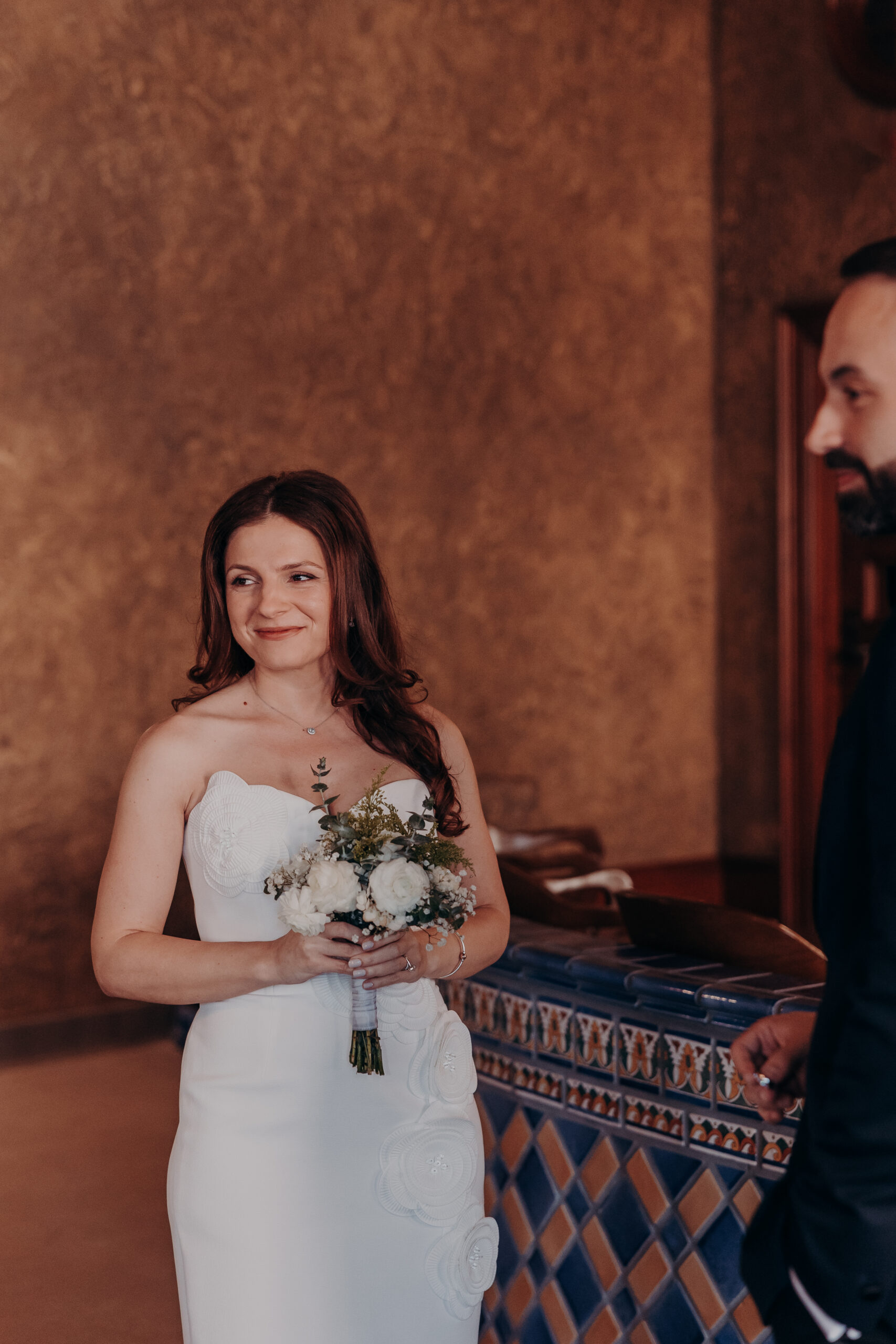 Close portrait of bride Diana smiling softly at her groom during their intimate Sarasota courthouse wedding ceremony