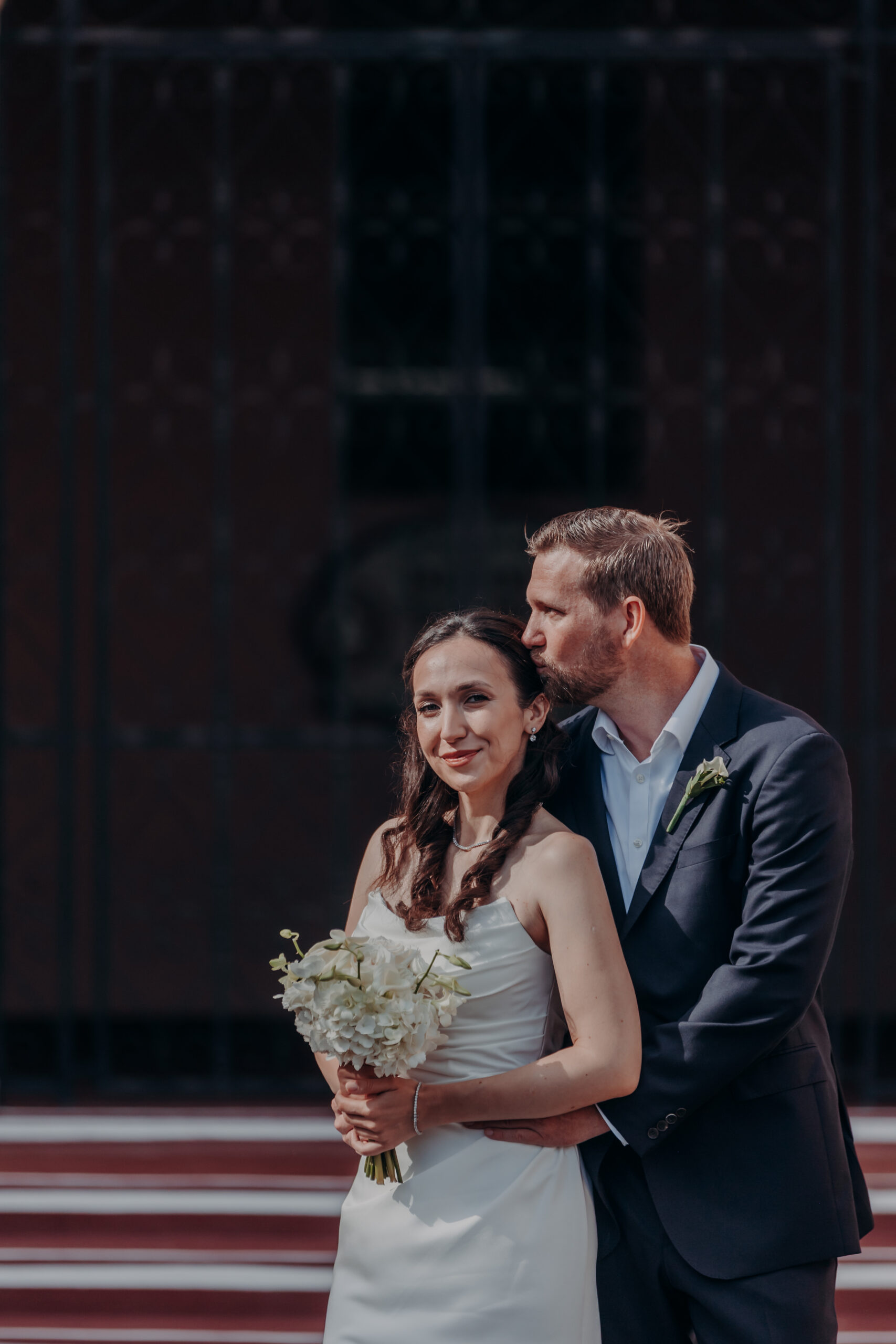 Will looking at Liza with a smile during their Sarasota FL courthouse wedding portraits