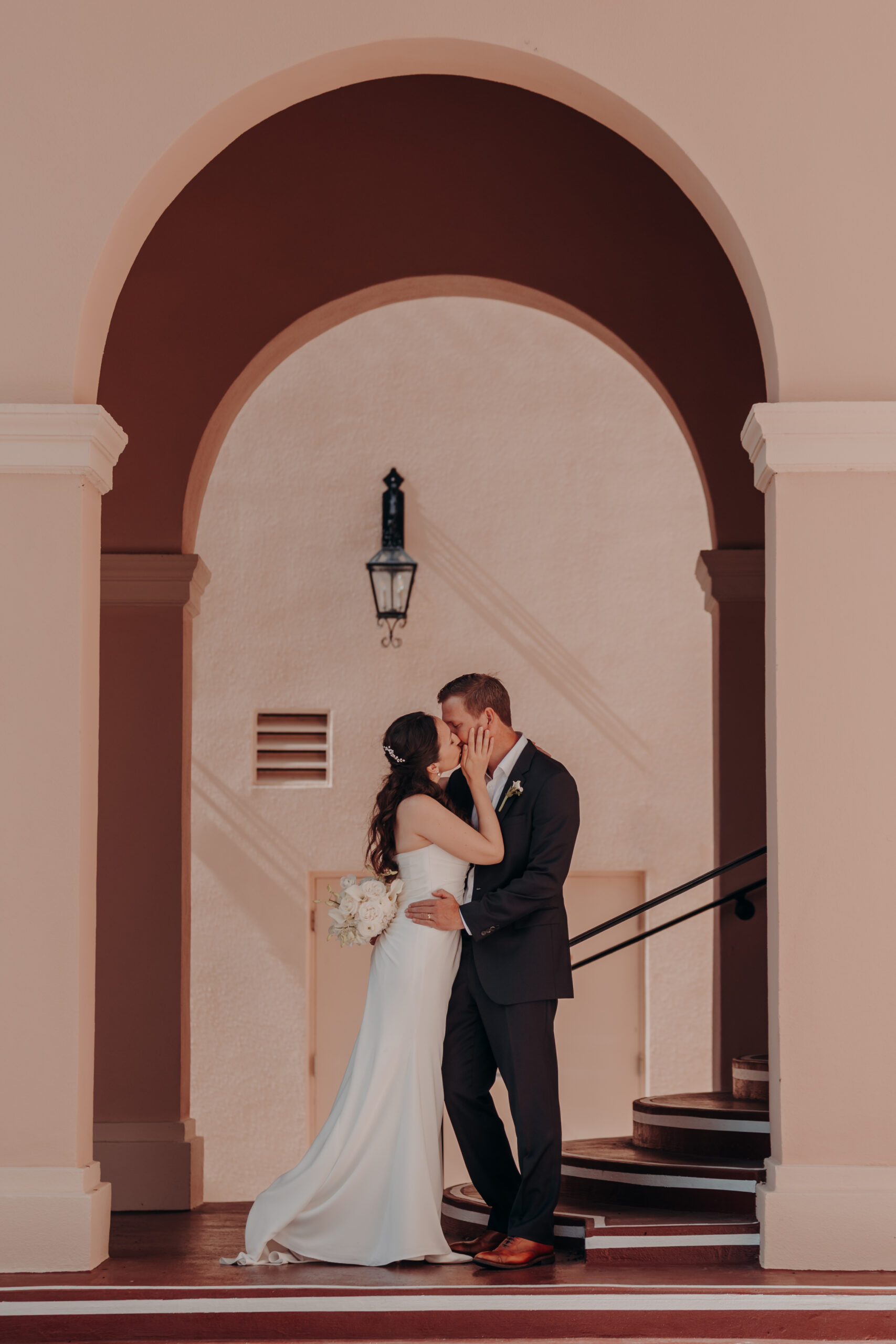 Liza and Will holding each other close in the vintage marriage parlor at the Sarasota courthouse