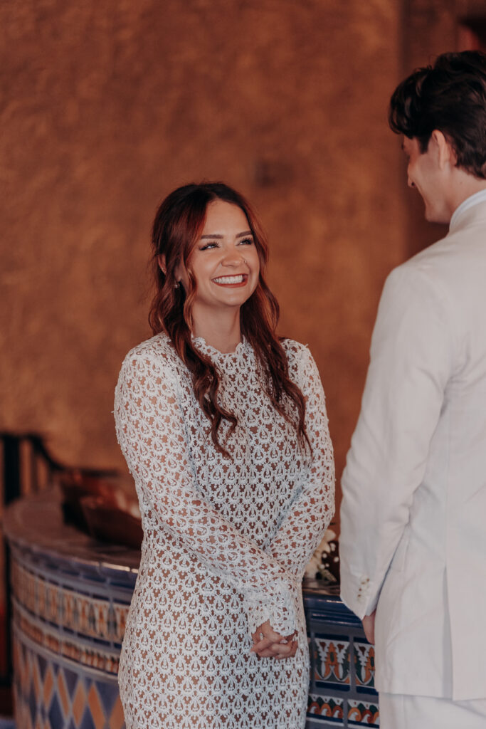 Mikaely laughing with pure joy during her elopement ceremony at the Historic Sarasota County Courthouse in Sarasota FL