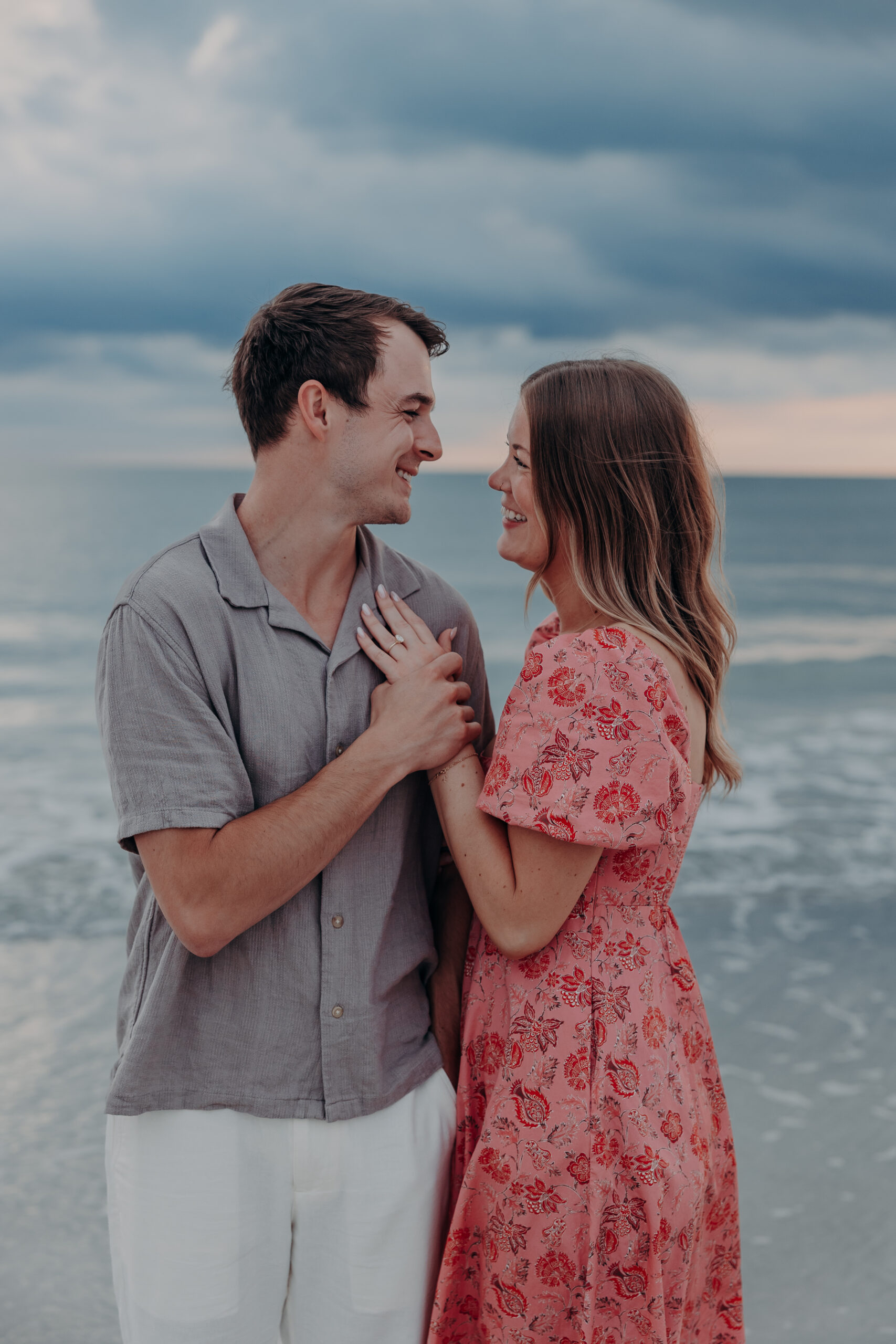 Dylan getting down on one knee proposing to Megan on Lido Beach Sarasota