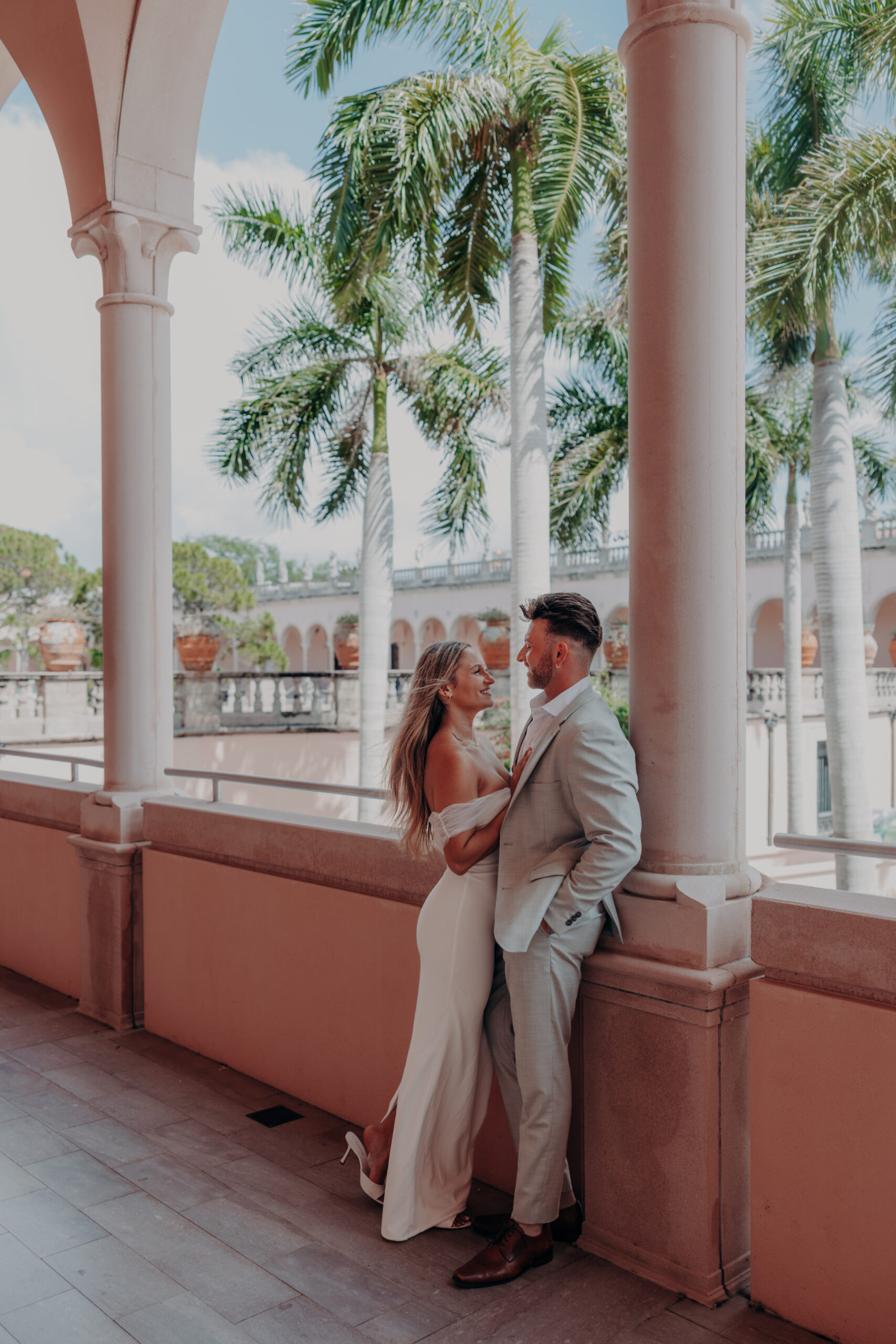 Romantic photo of couple at the Ringling Museum archway Sarasota Florida engagement photographer