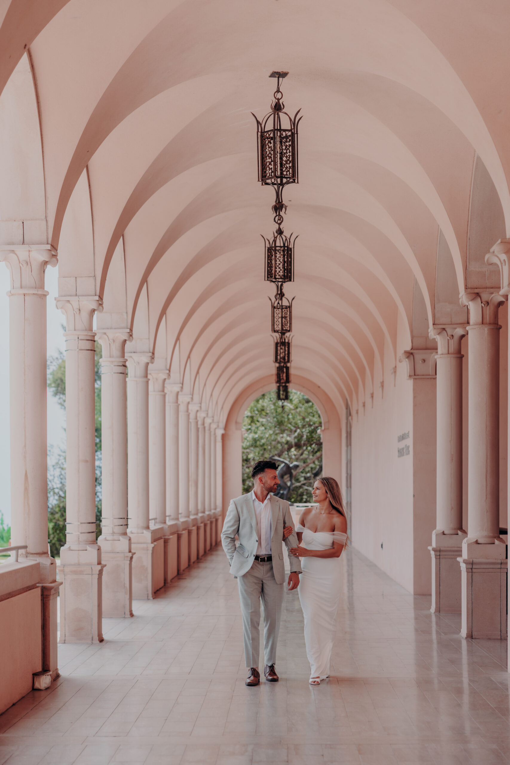 Engaged couple embracing in the Italian garden at the Ringling estate Sarasota Florida