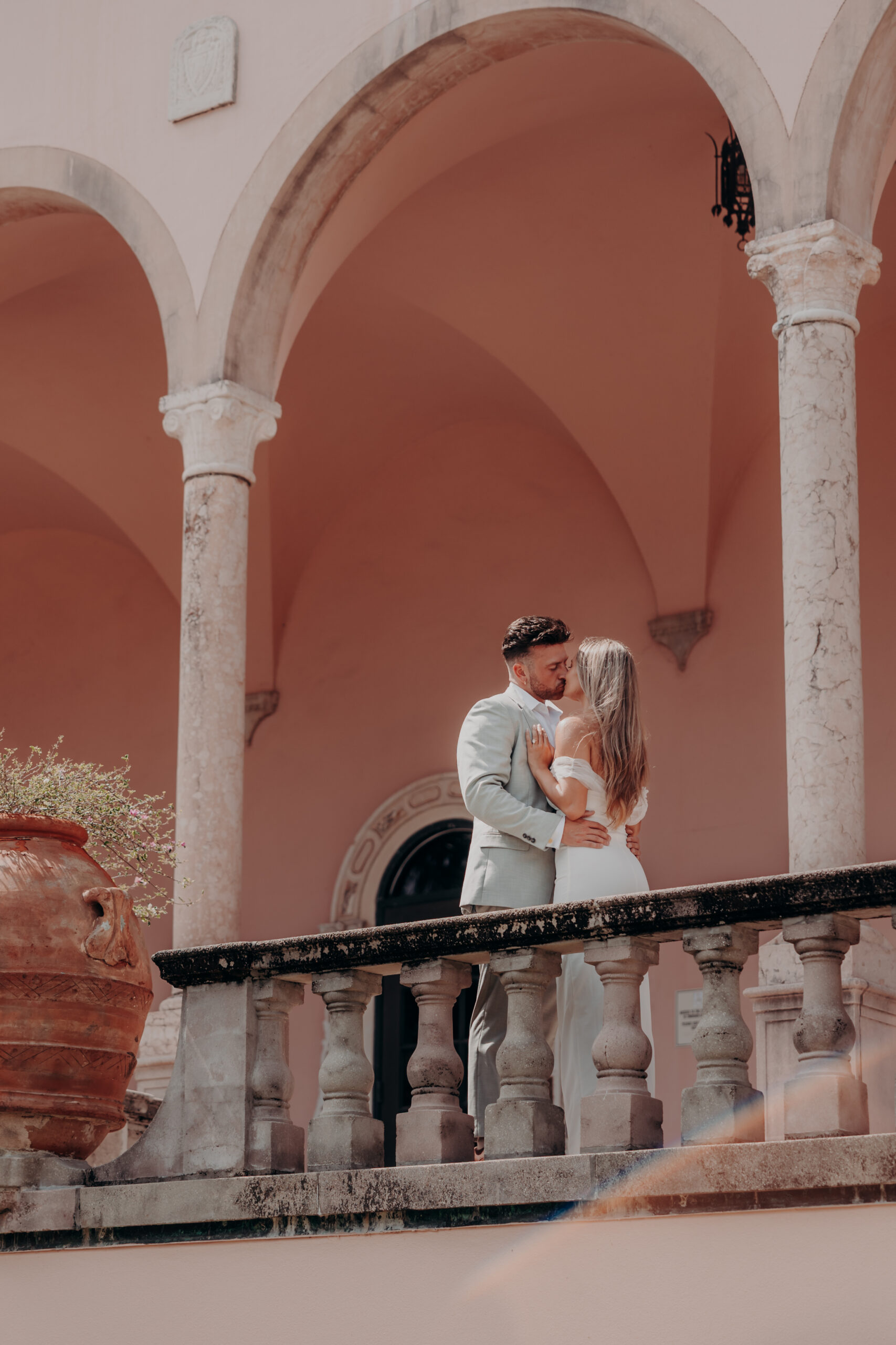 Gabe and Nicole holding hands walking at the Ringling Museum of Art Sarasota Florida engagement