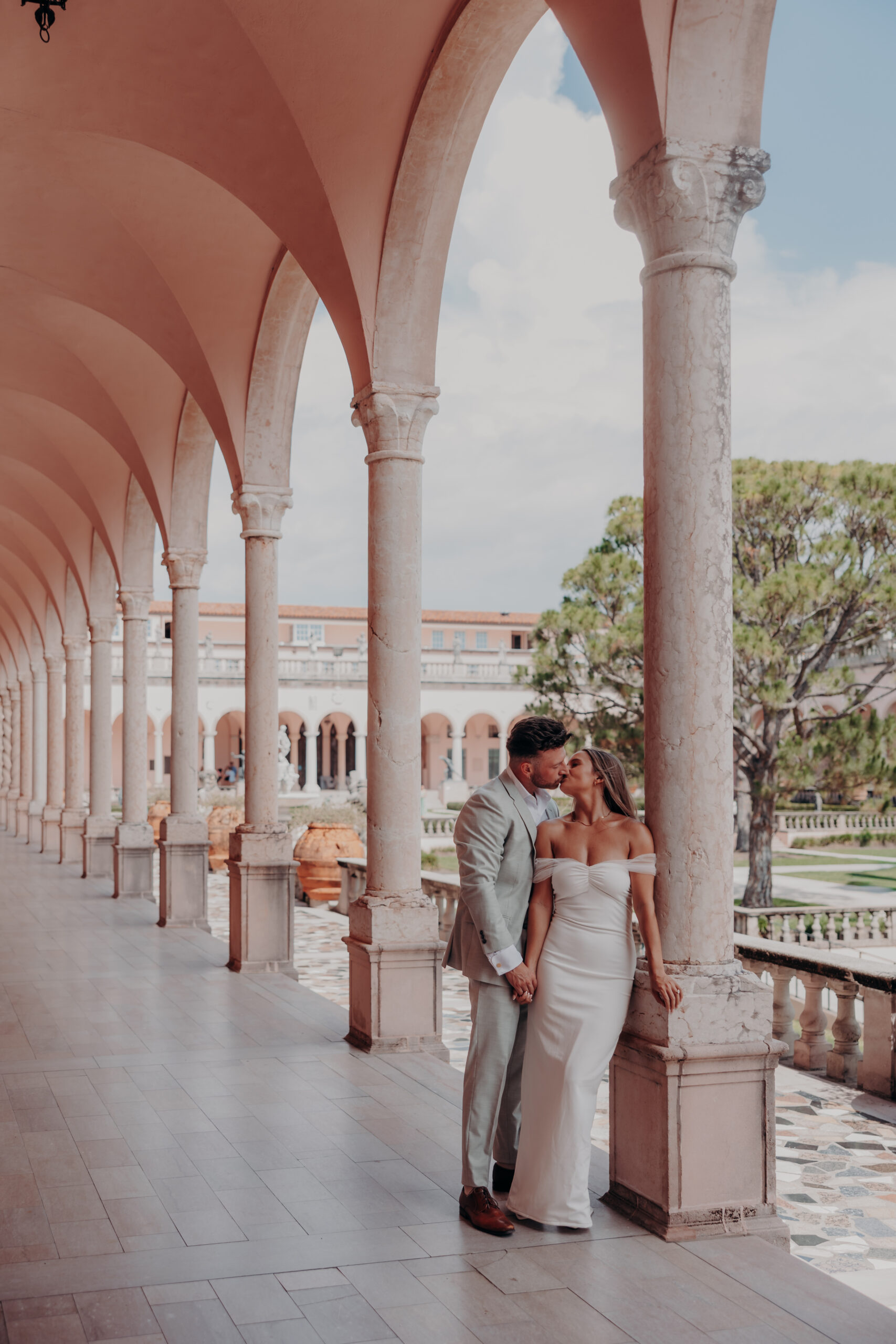 Couple posing in the courtyard at the John and Mable Ringling Museum of Art Sarasota Florida