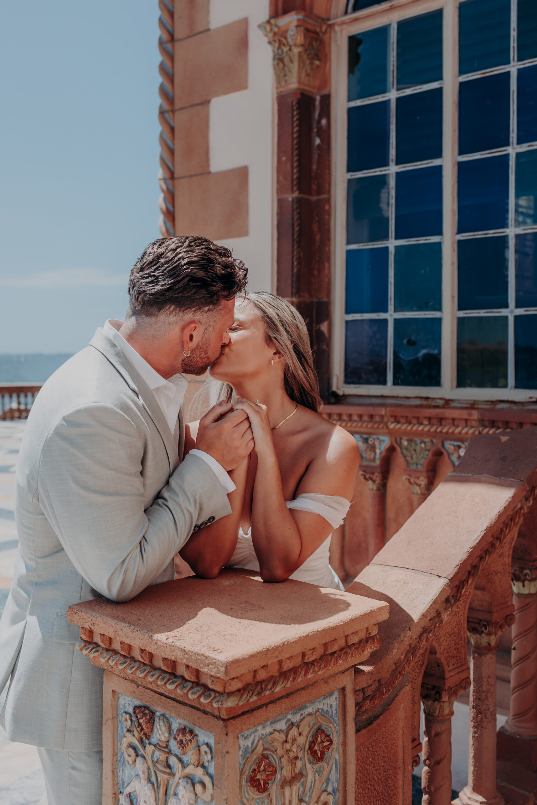 Newly engaged couple hugging and laughing at the John and Mable Ringling Museum of Art Sarasota