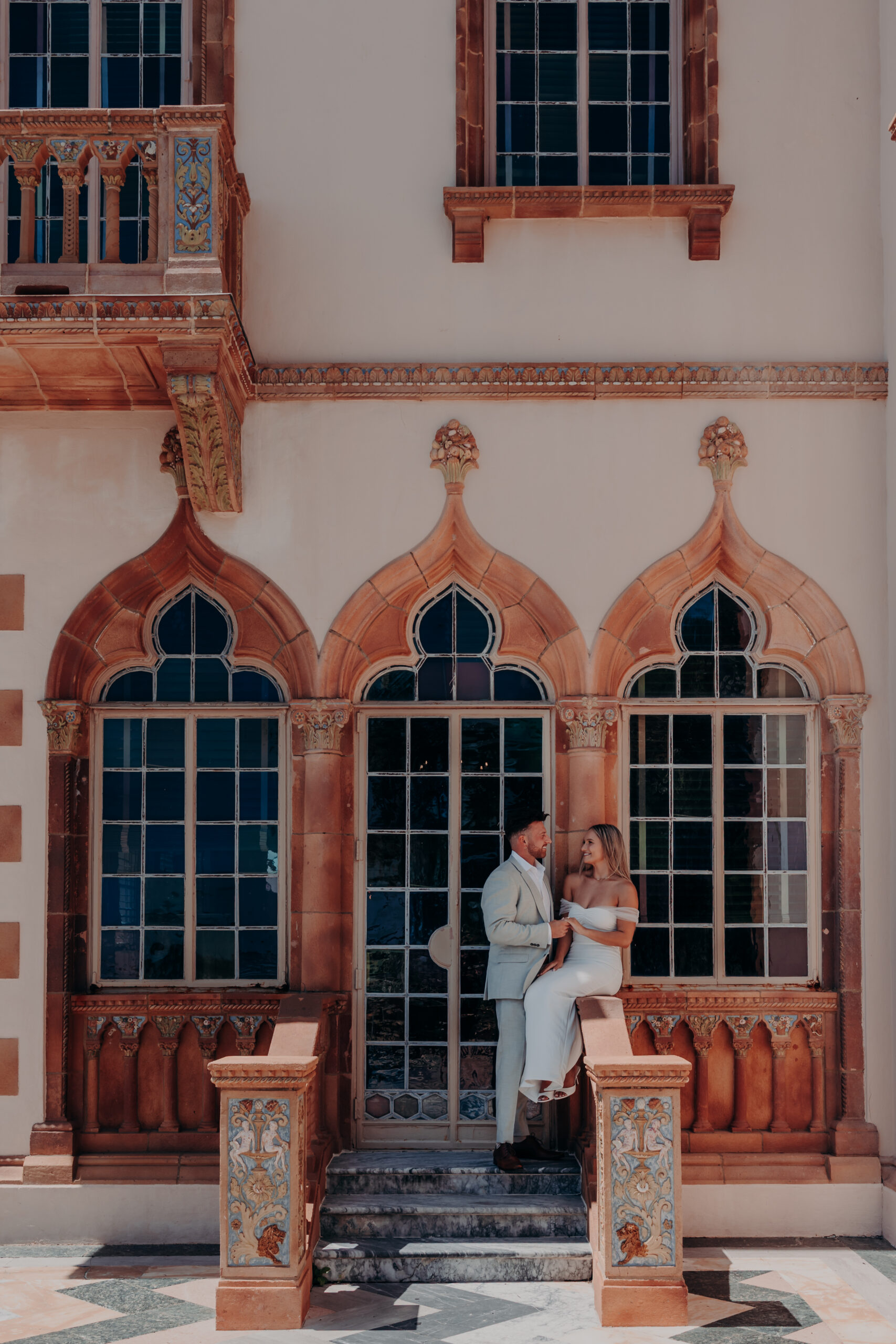Gabe on one knee proposing to Nicole at the Ringling Museum of Art Sarasota Florida surprise proposal