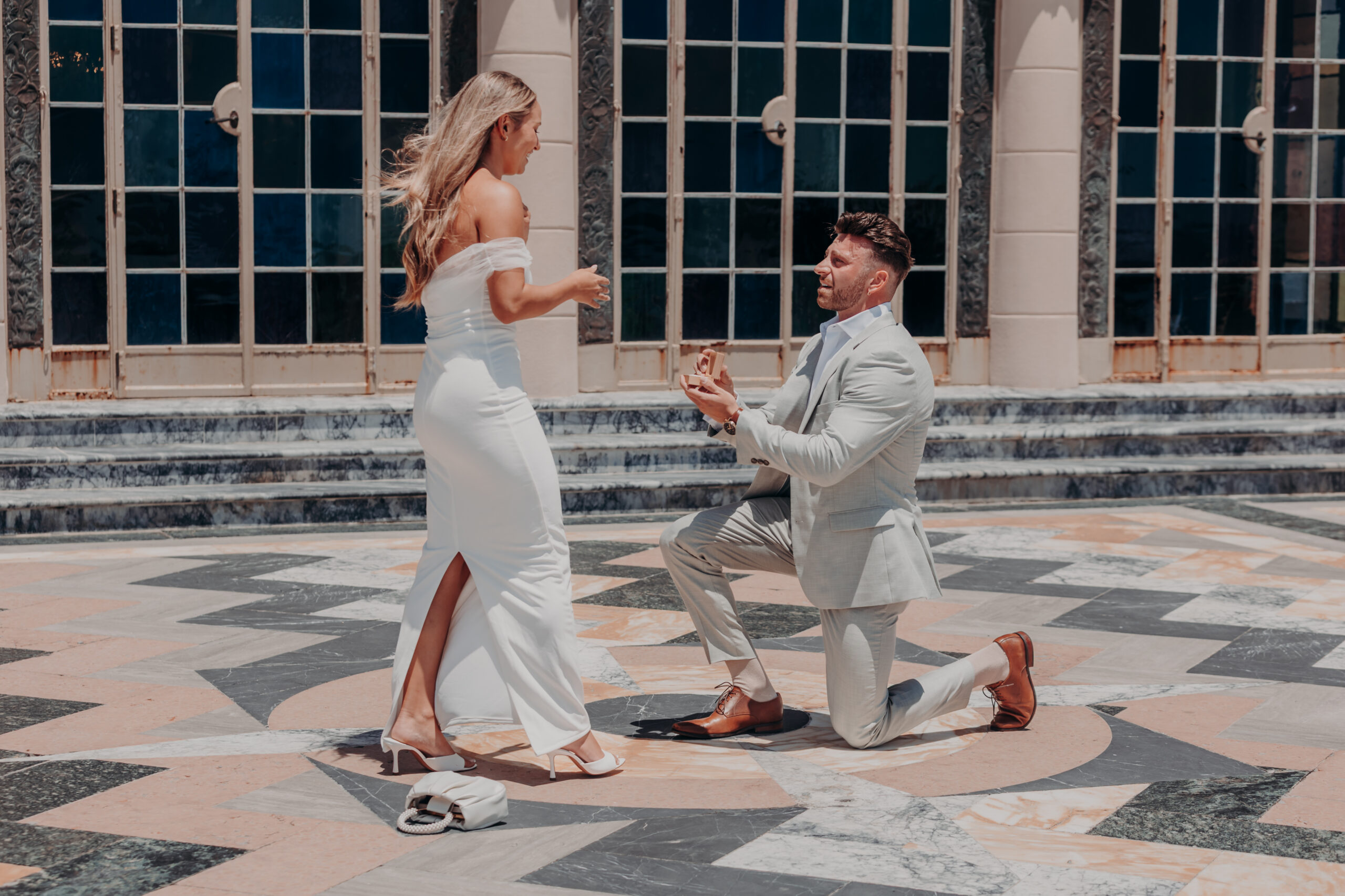 Engaged couple walking hand in hand at the Ringling Museum of Art Sarasota Florida