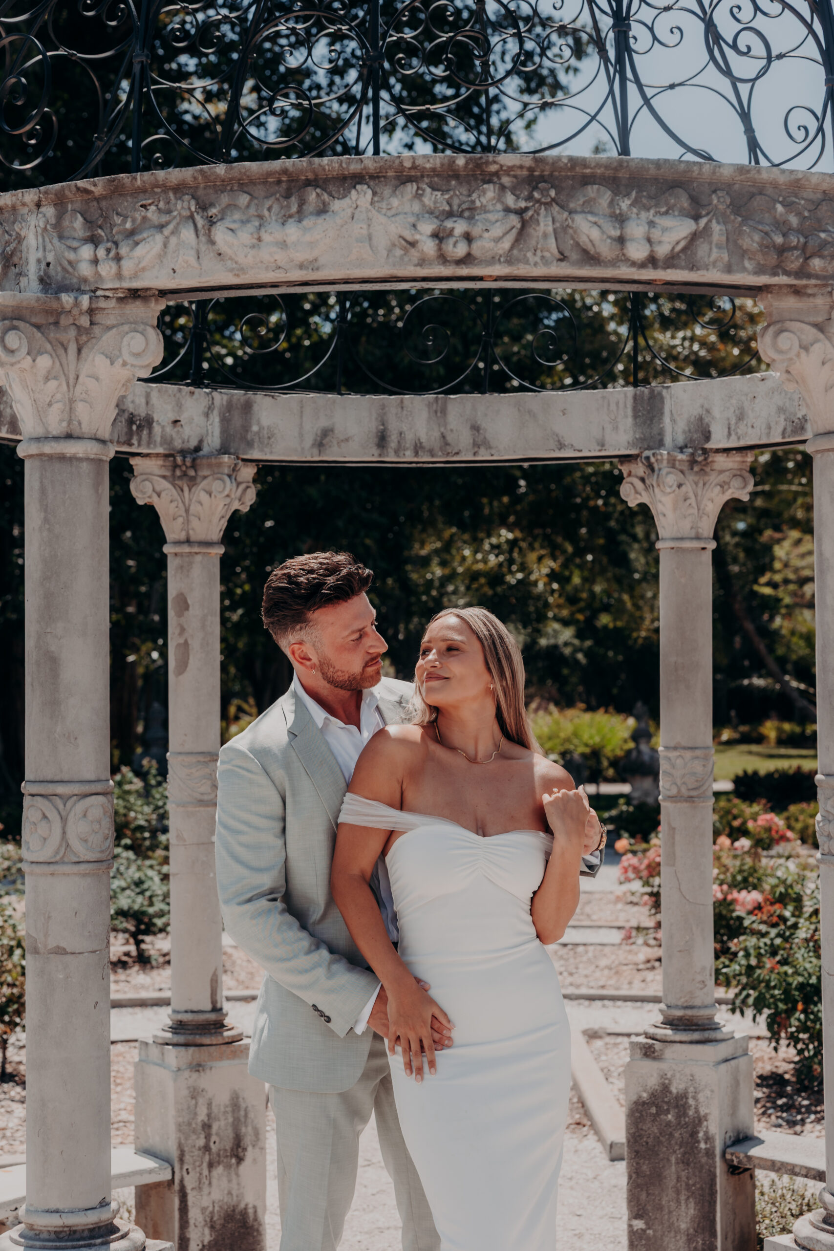 Nicole and Gabe laughing together at the Ringling Museum of Art Sarasota Florida engagement photos