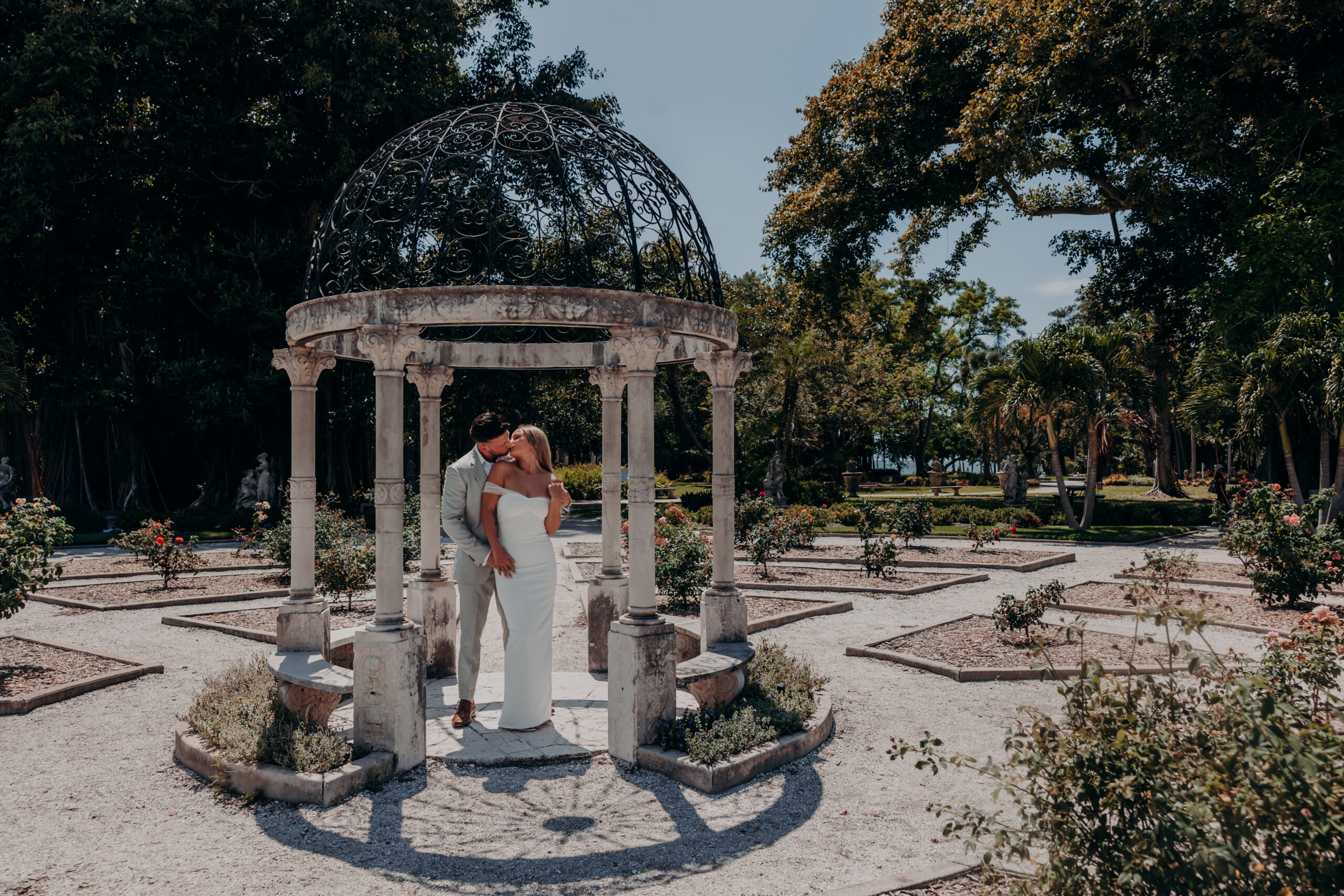 Wide shot of Nicole and Gabe in the Italian garden at John and Mable Ringling Museum Sarasota