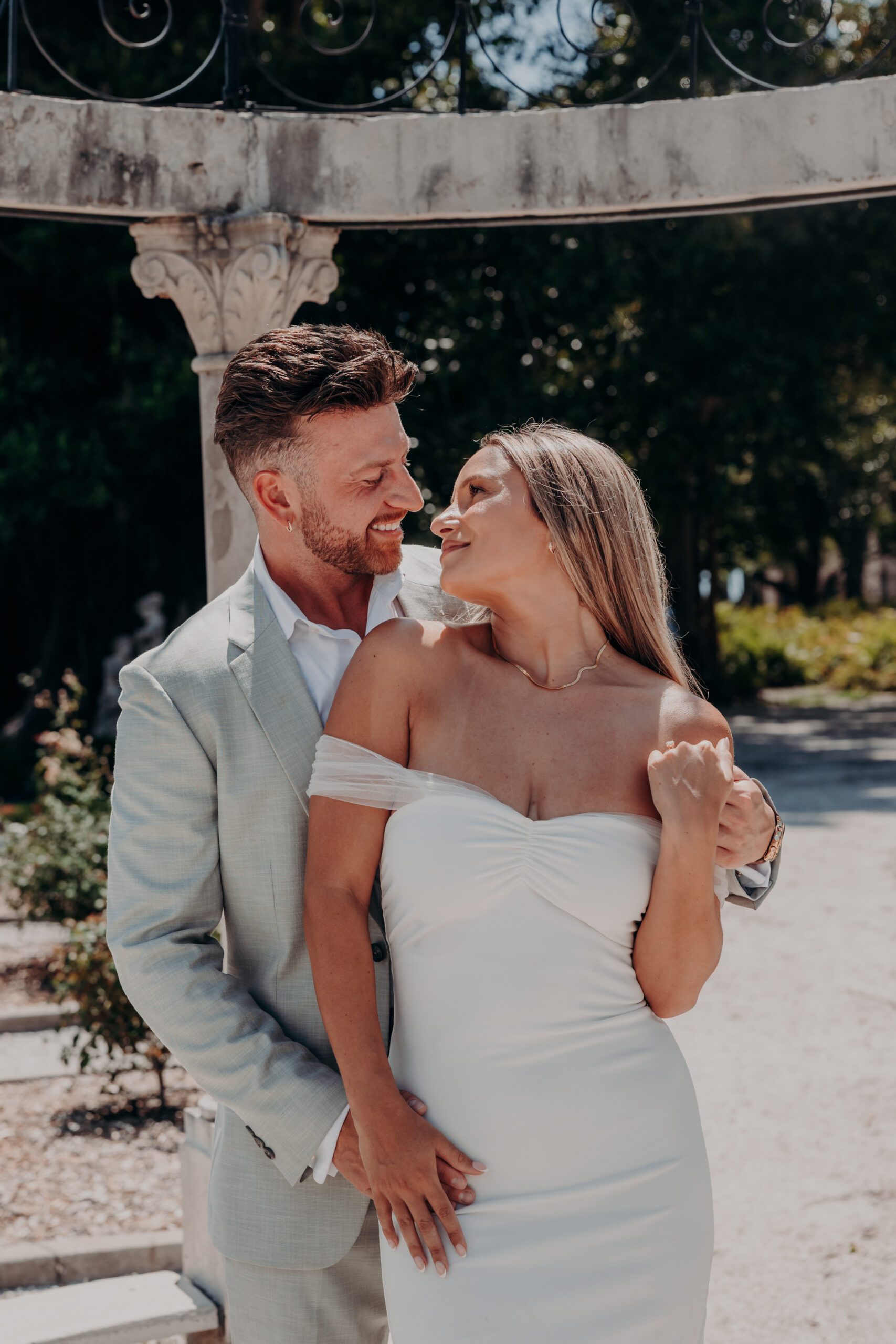Couple posing near the fountain at the Ringling estate Sarasota Florida proposal photographer
