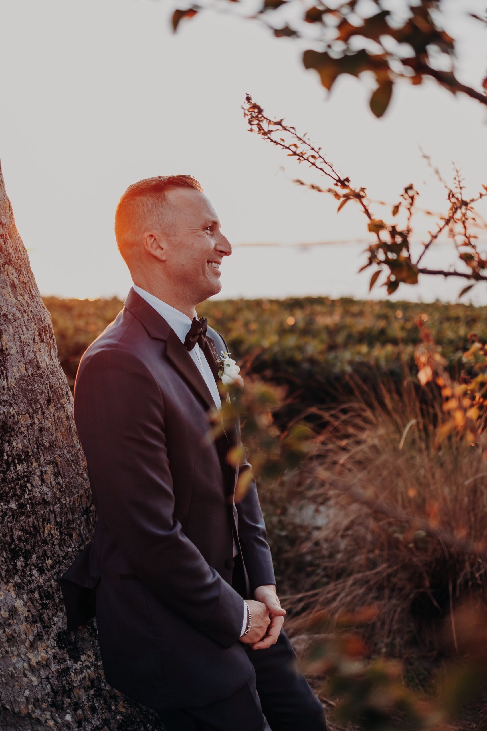 Bride and groom sunset portraits at Marie Selby Botanical Gardens waterfront Sarasota