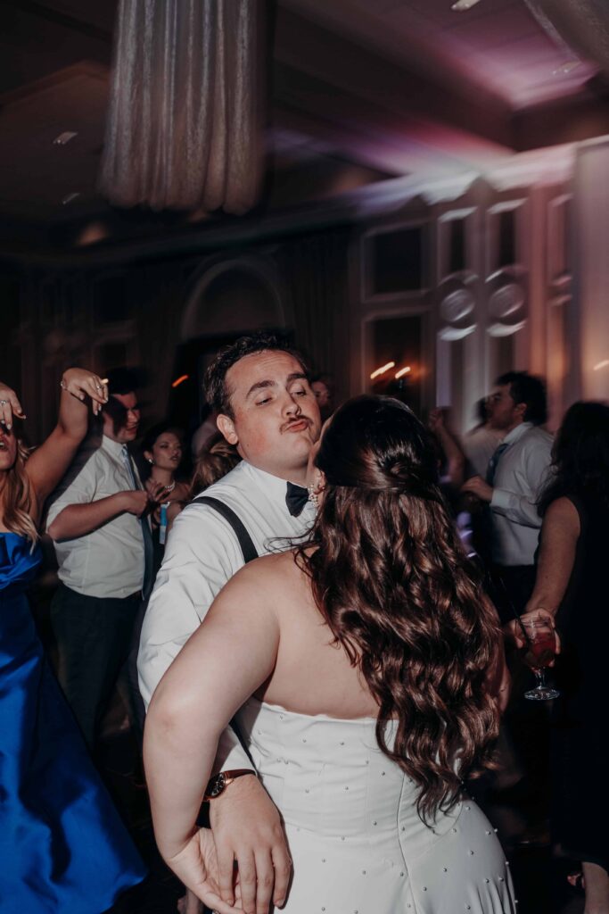Bride and groom dancing together at Lakewood Ranch Golf and Country Club wedding reception