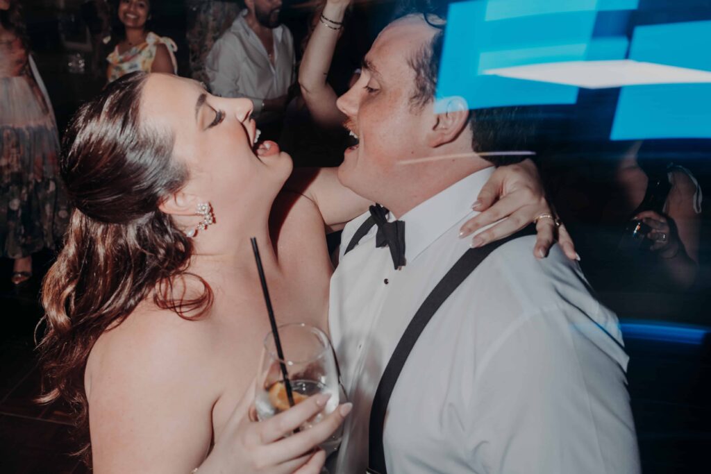 Bride and groom laughing together at end of their Lakewood Ranch Golf and Country Club wedding night