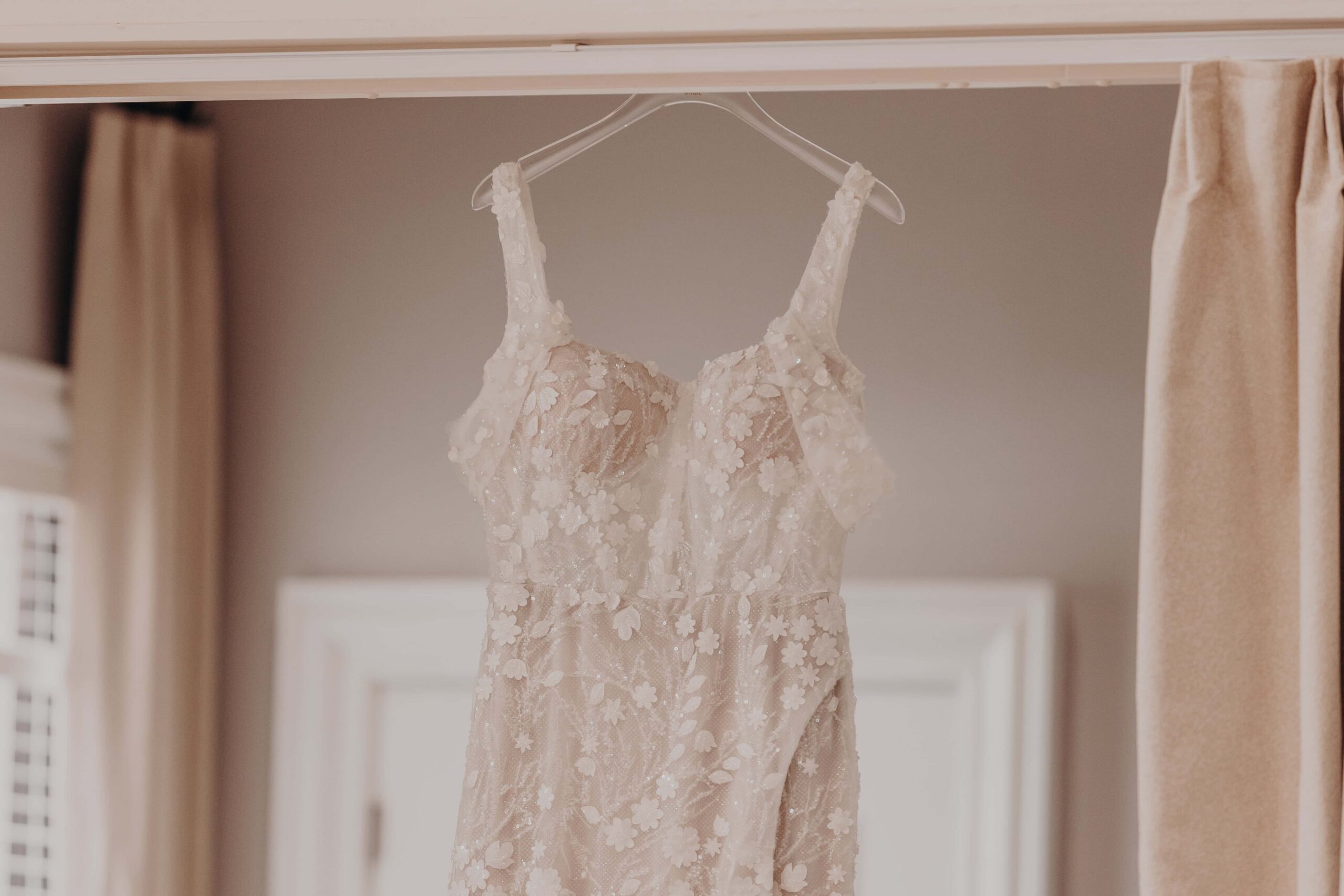 Bride Brianna in her 3D floral lace applique wedding gown from The Perfect Dress Sarasota getting ready at LRCC