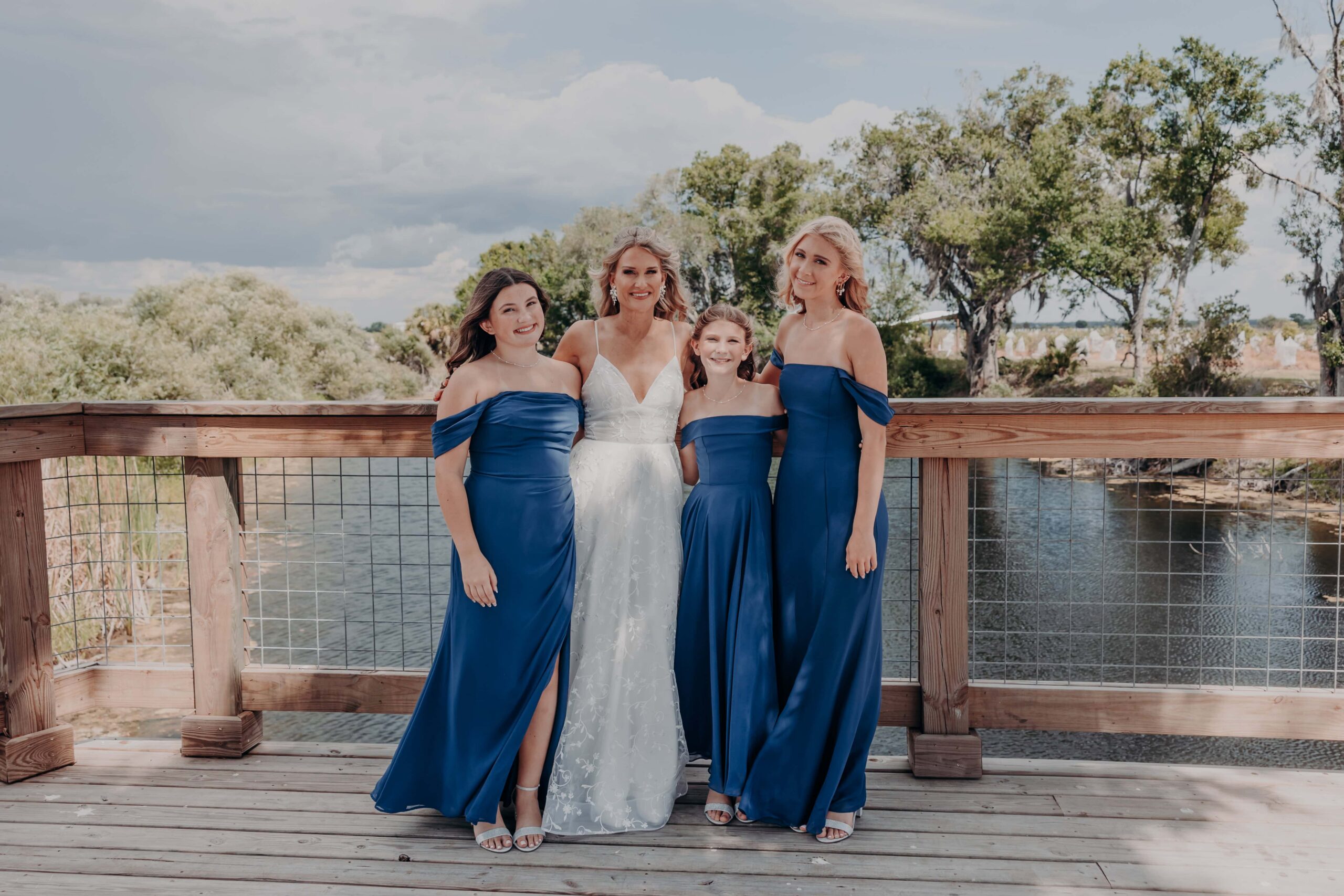 Bride Debbie with all three daughters before wedding at Brown's Grove Farm Sarasota Florida