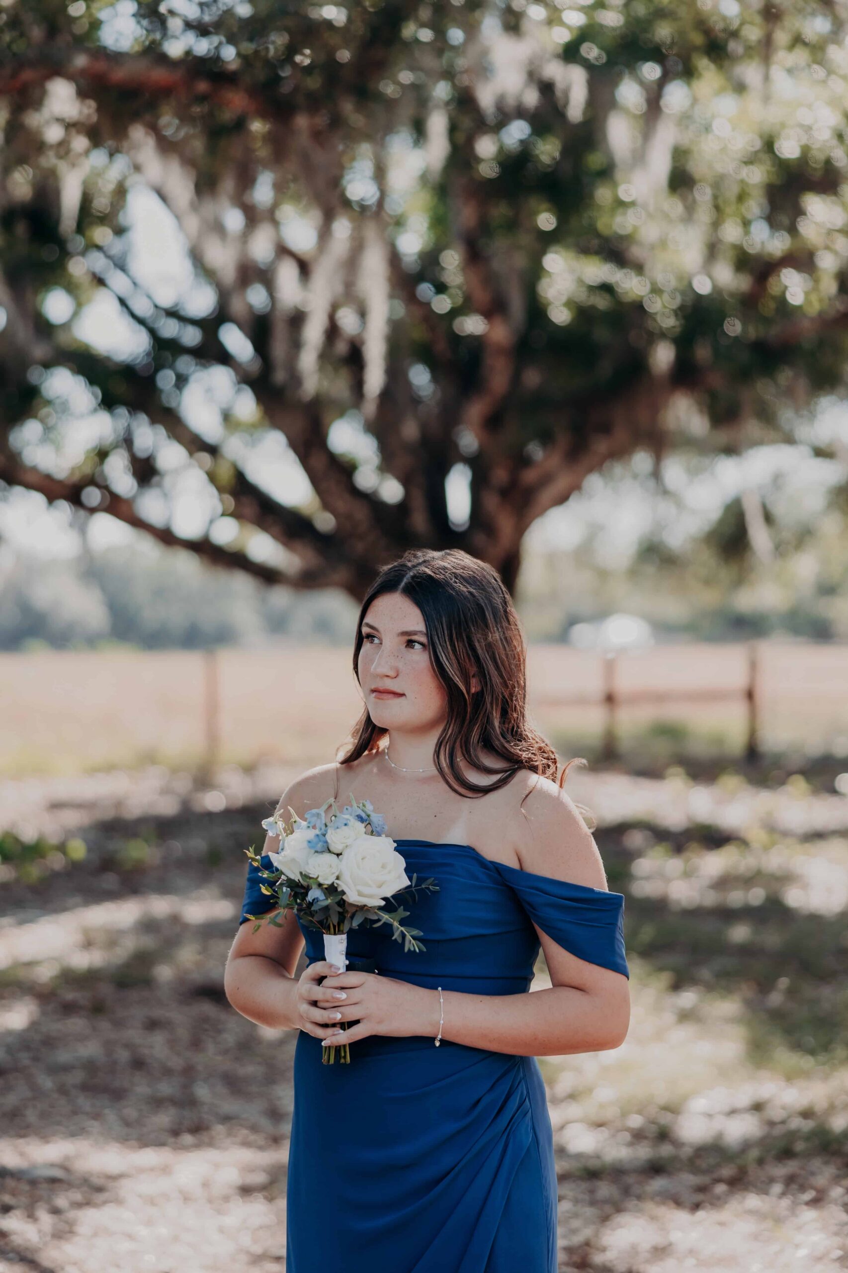 Daughter portrait under Spanish moss oak tree at Brown's Grove Farm wedding