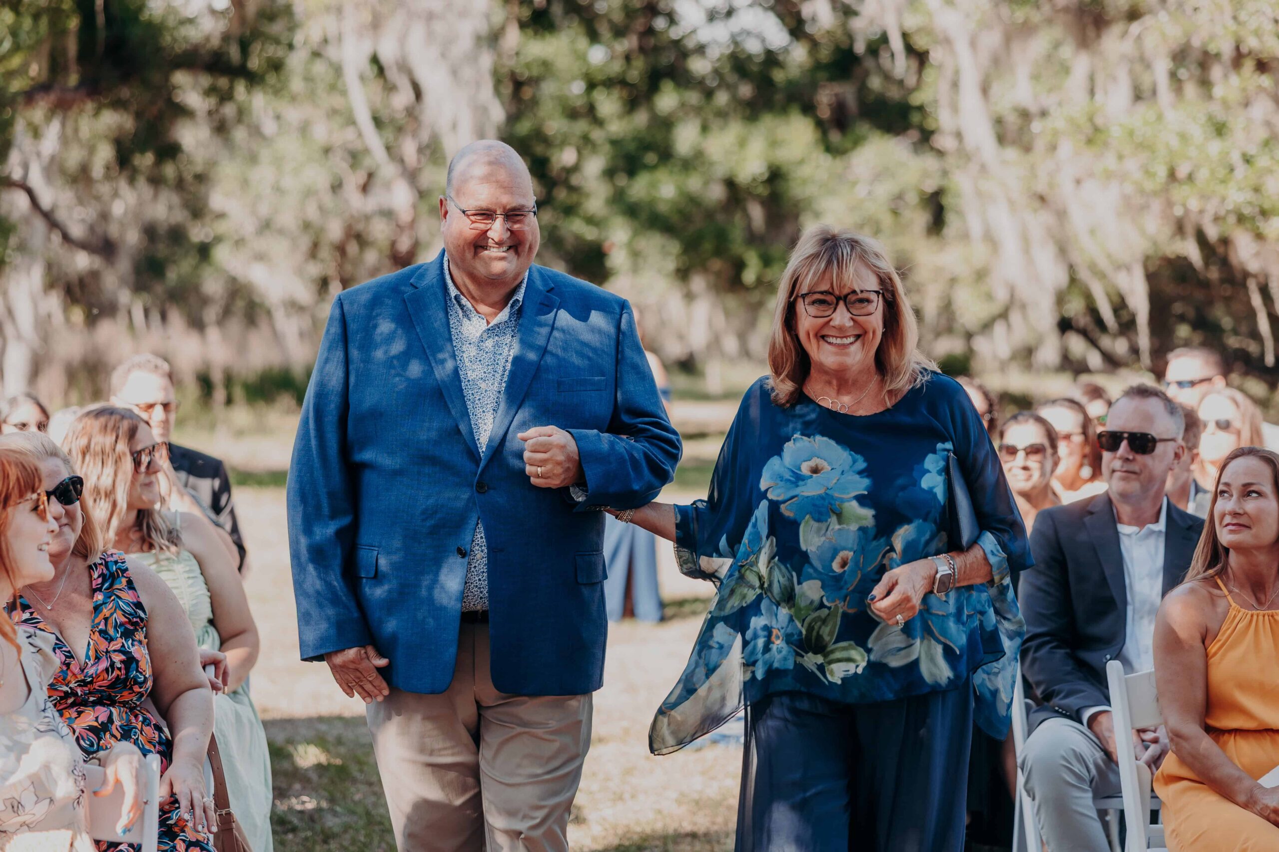 Parents processional walking down aisle at Brown's Grove Farm wedding ceremony