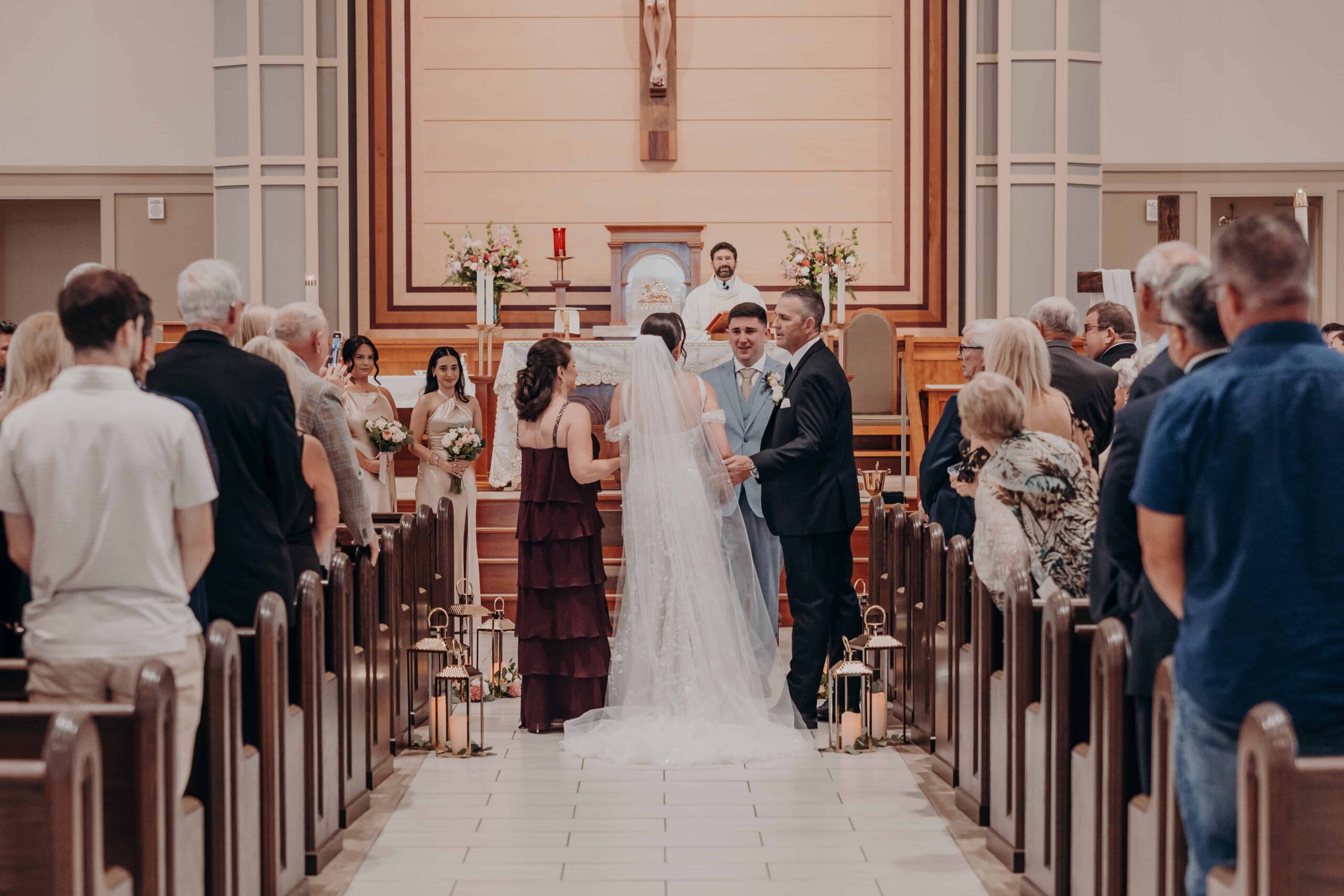 Catholic wedding ceremony at Our Lady of the Angels Catholic Church in Lakewood Ranch Florida photographed by Angela Moon Photography Sarasota