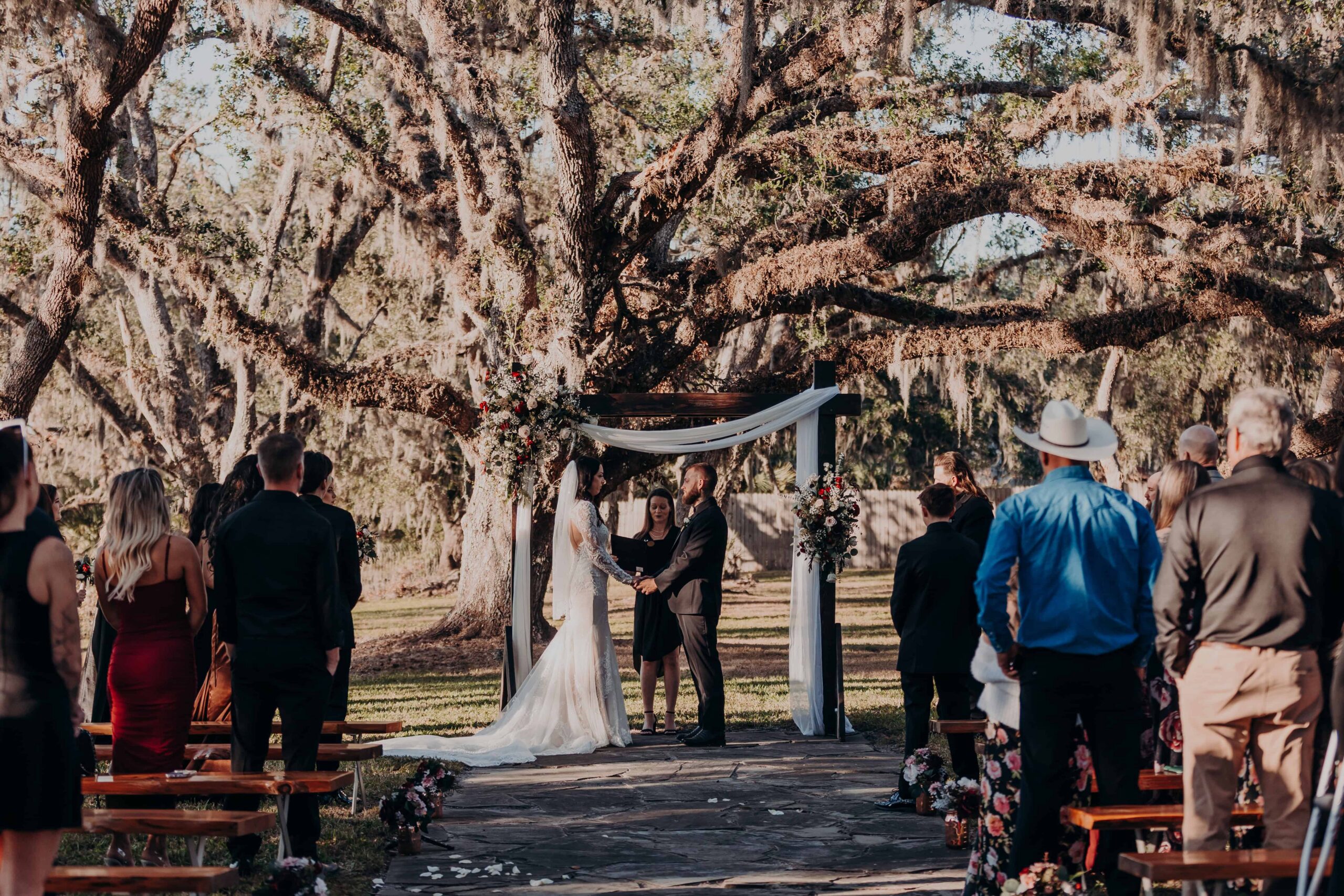 Wedding ceremony under massive Spanish moss oak tree at Diamond C Ranch in Myakka City Florida