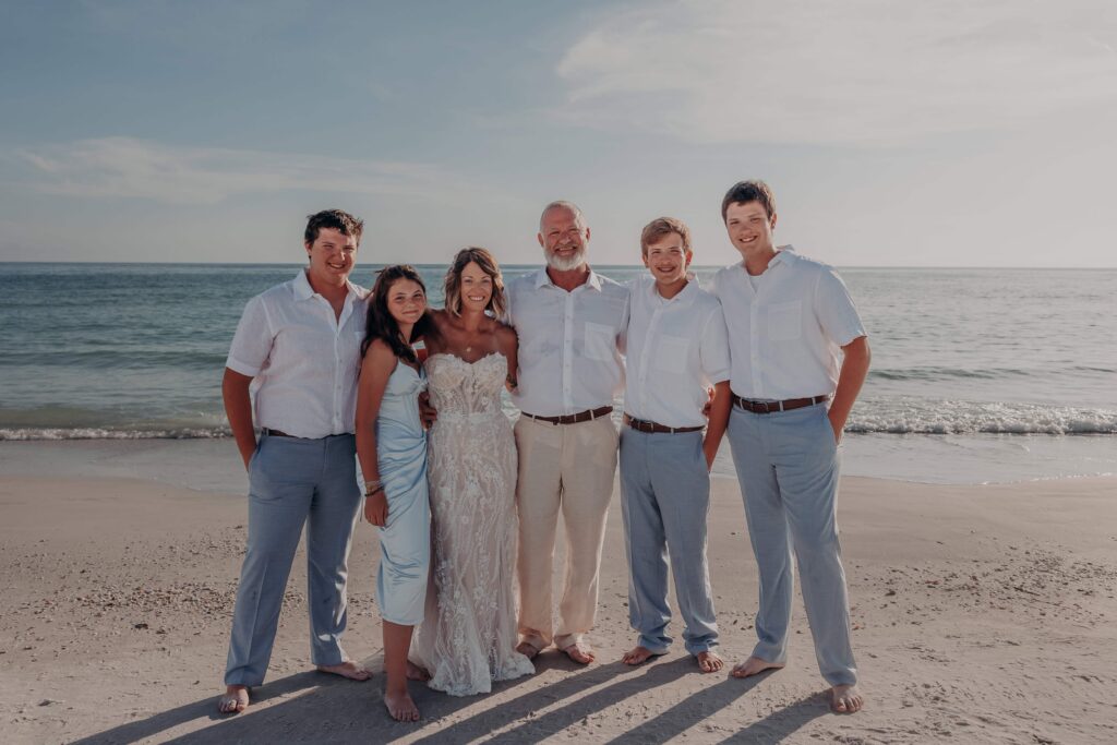 Family portrait with children at Sarah and Jasen Siesta Key beach elopement Sarasota