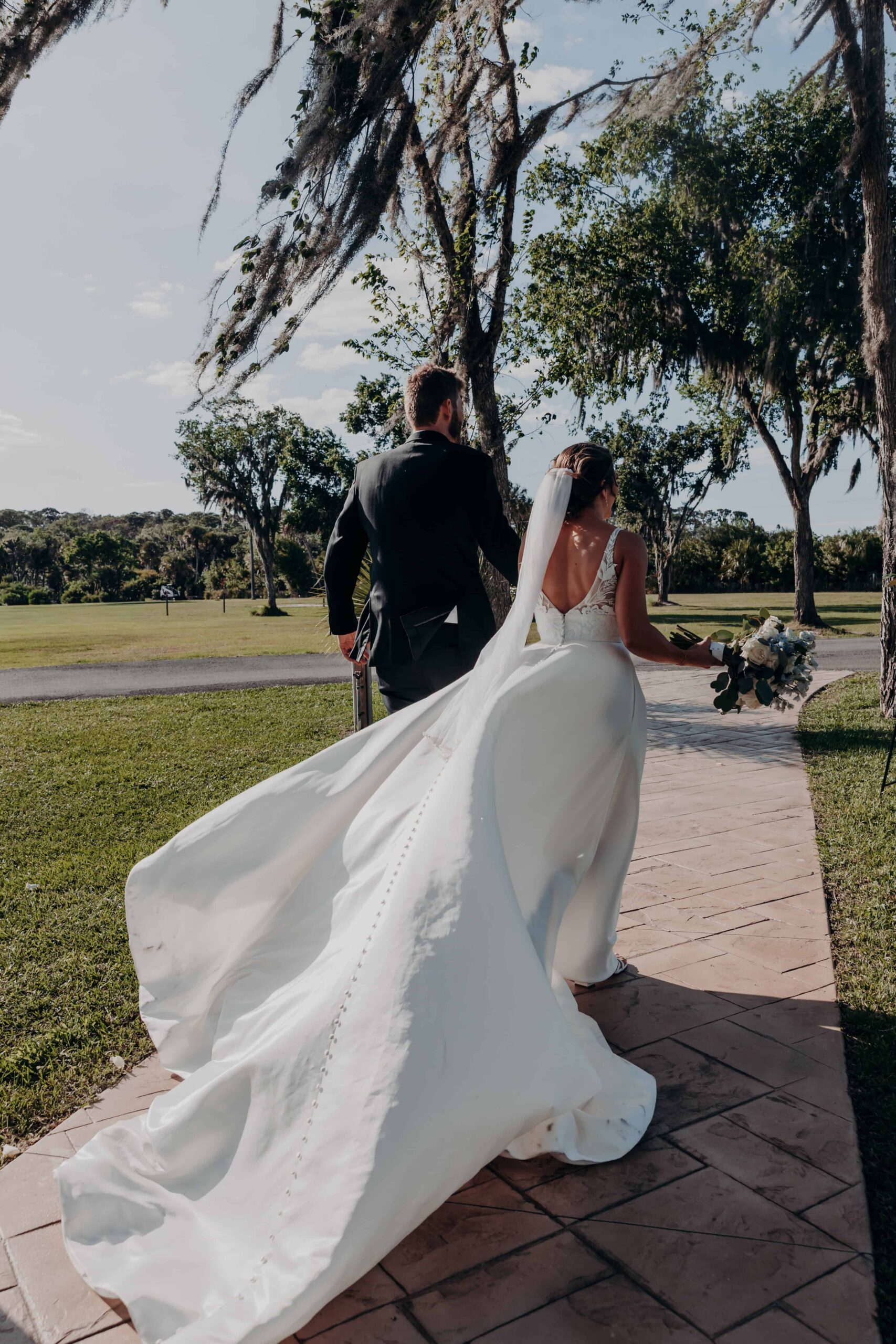 Hidden Acres wedding bride and groom portrait with veil in Spanish moss trees