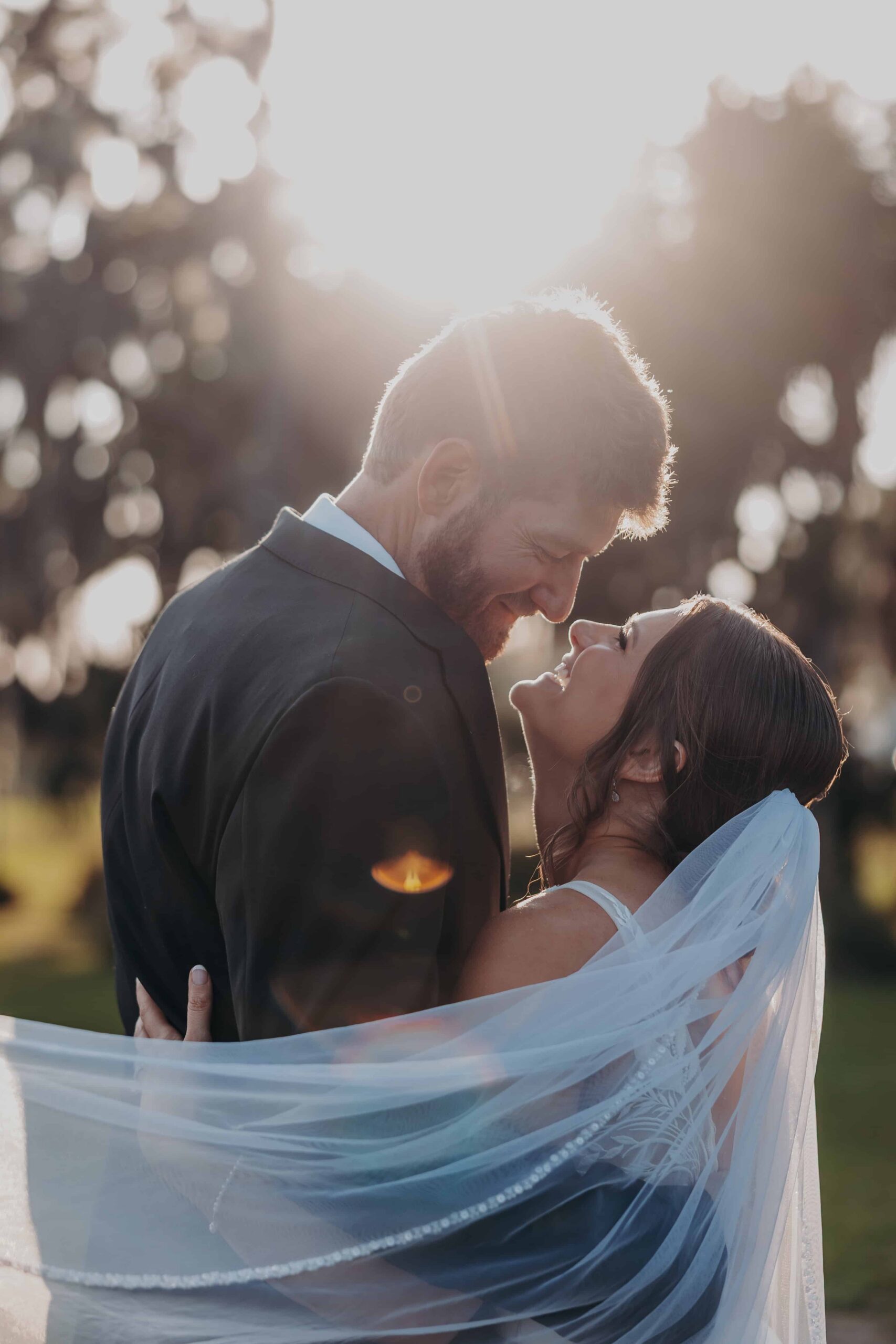 Hidden Acres wedding bride and groom veil forehead touch golden hour