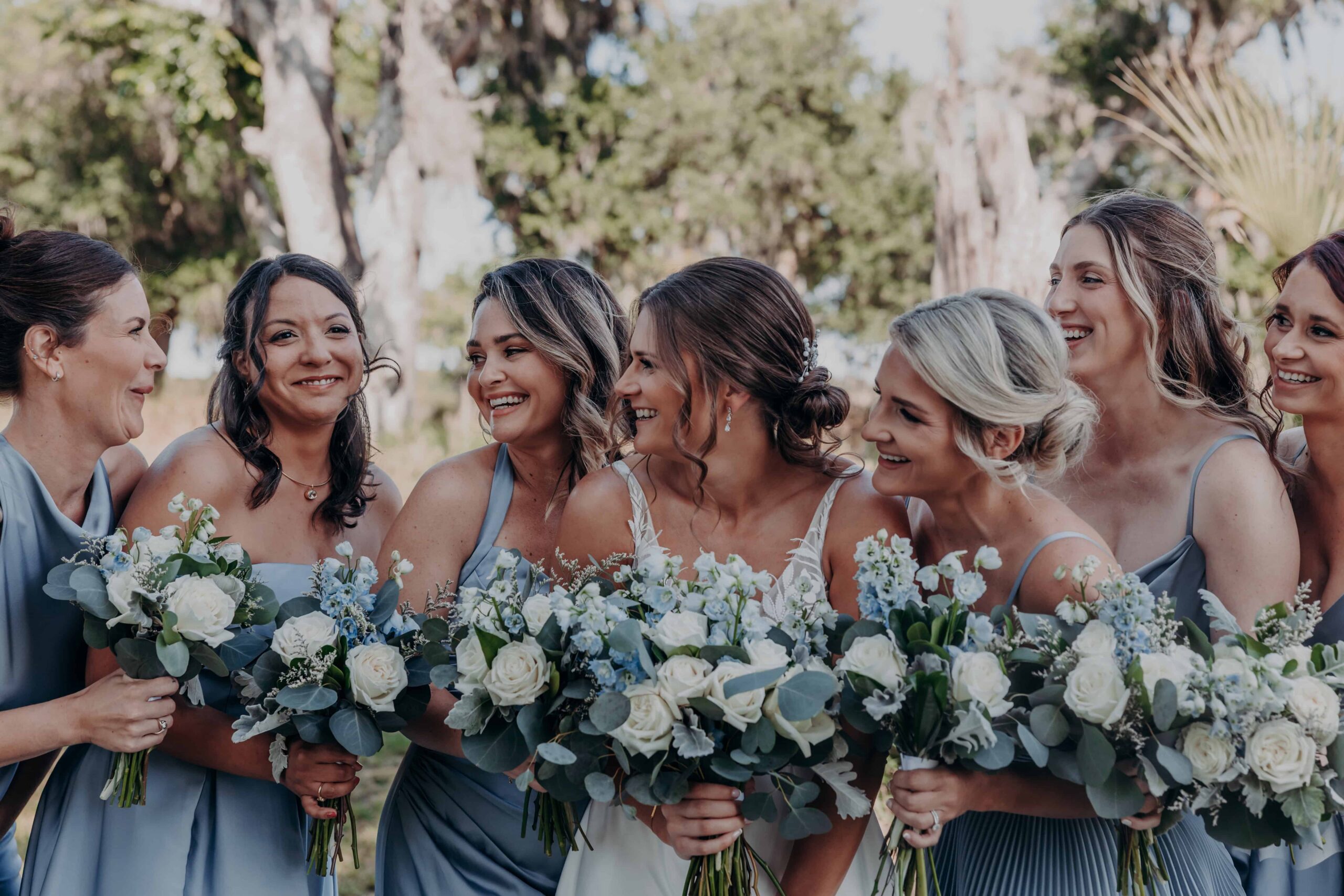 Hidden Acres wedding bridesmaids laughing candid moment holding bouquets