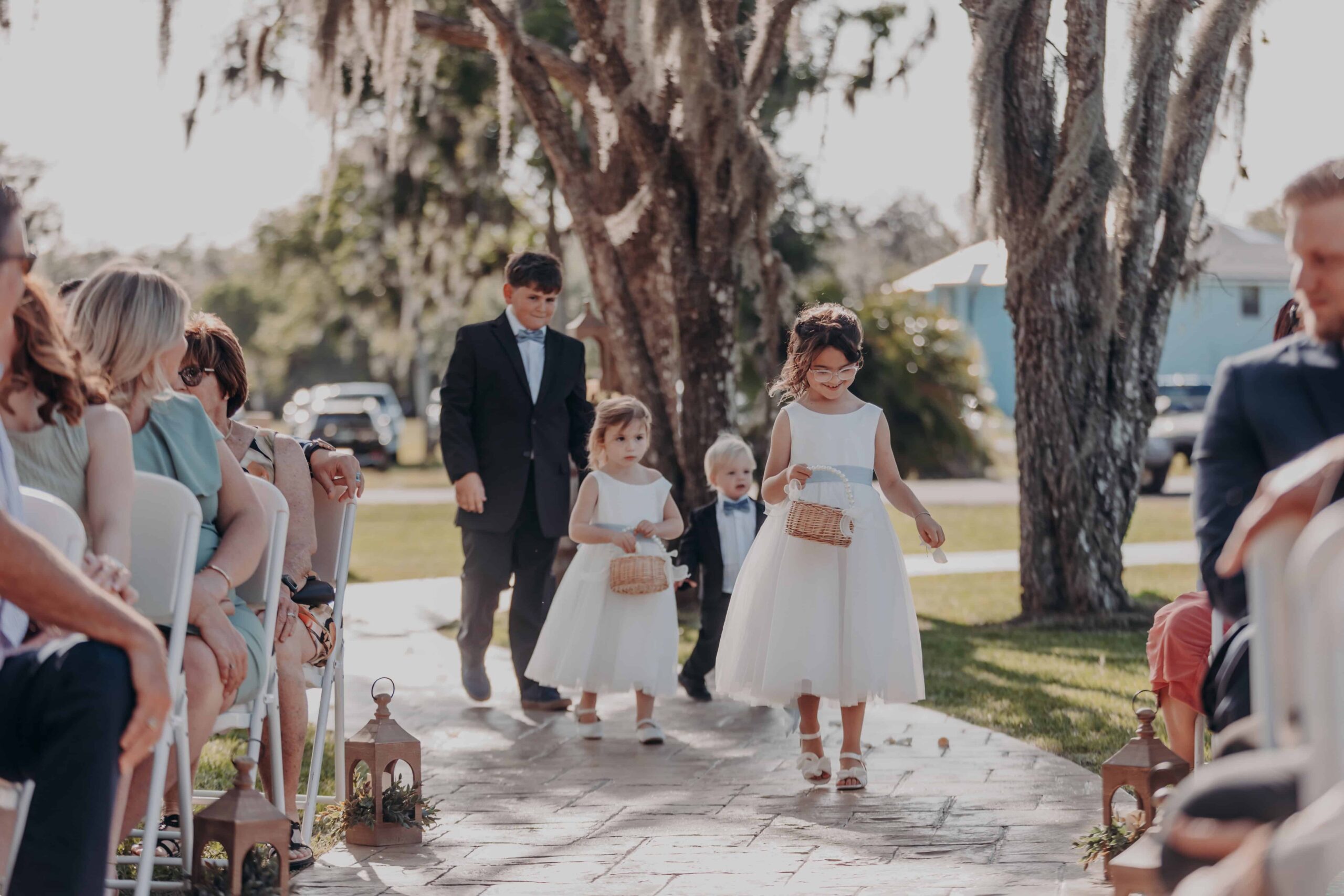 Hidden Acres wedding ceremony flower girls and ring bearer walking down aisle
