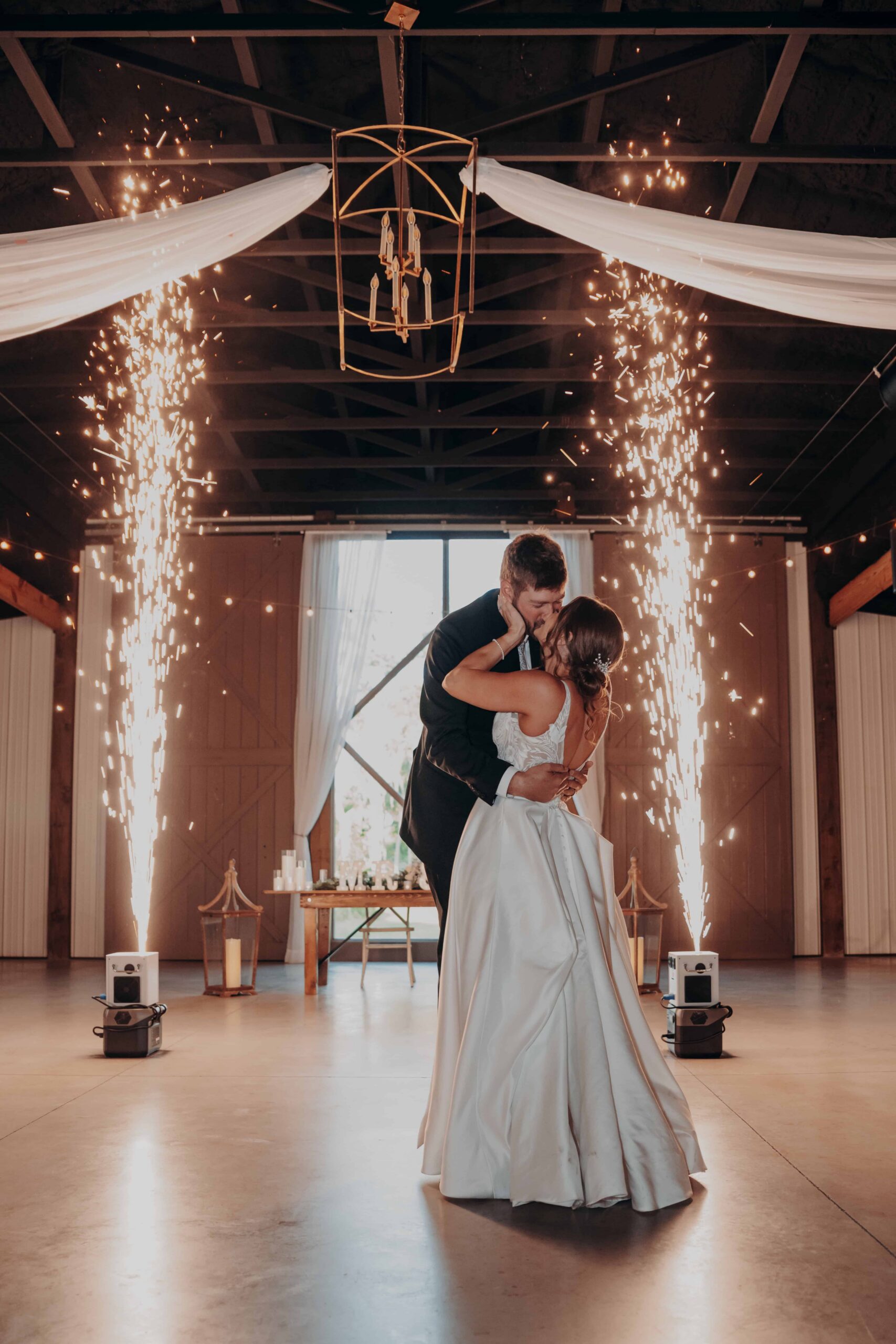 Hidden Acres wedding first dance cold sparklers barn kiss