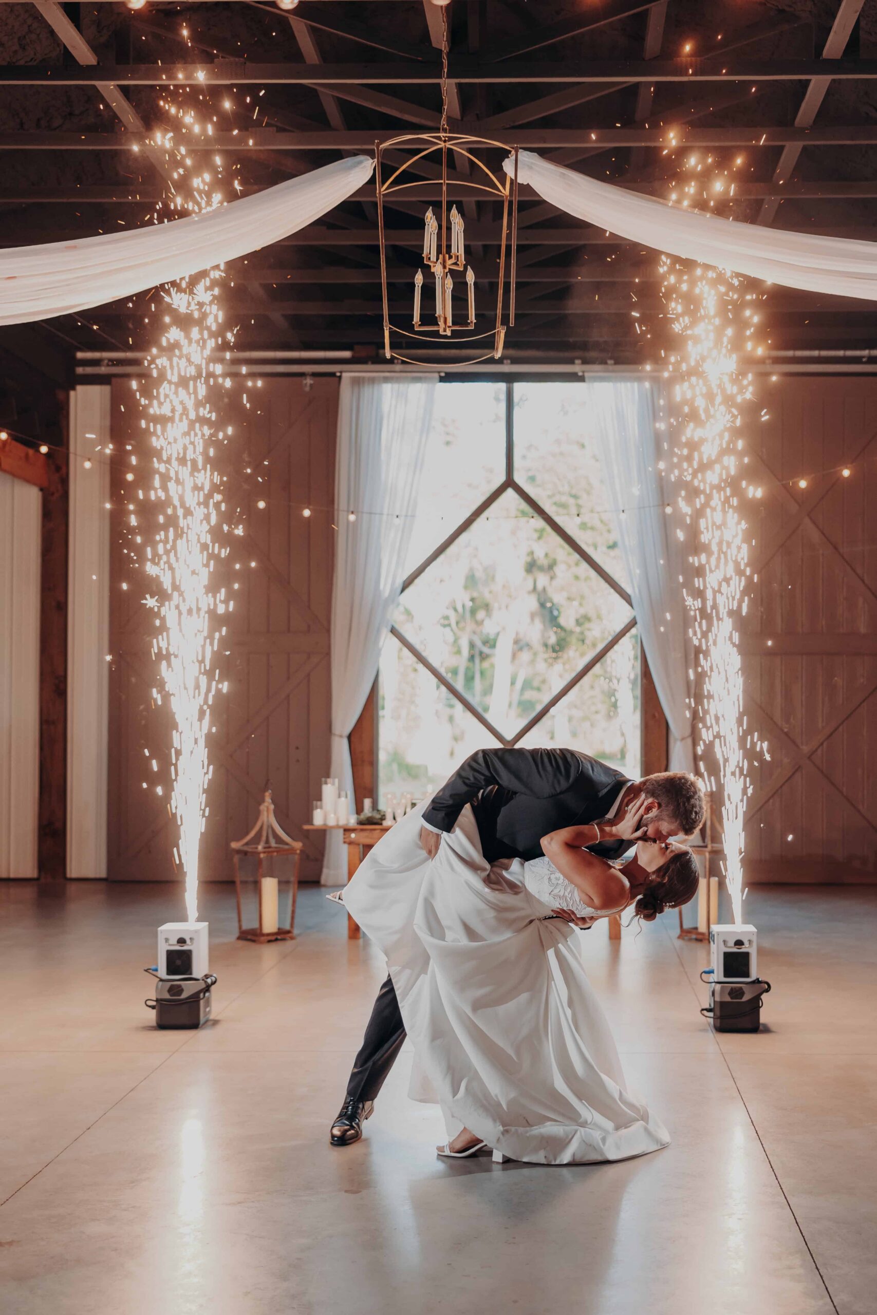 Hannah and Sean first dance cold sparklers dip kiss at The Venue at Hidden Acres Palmetto Florida